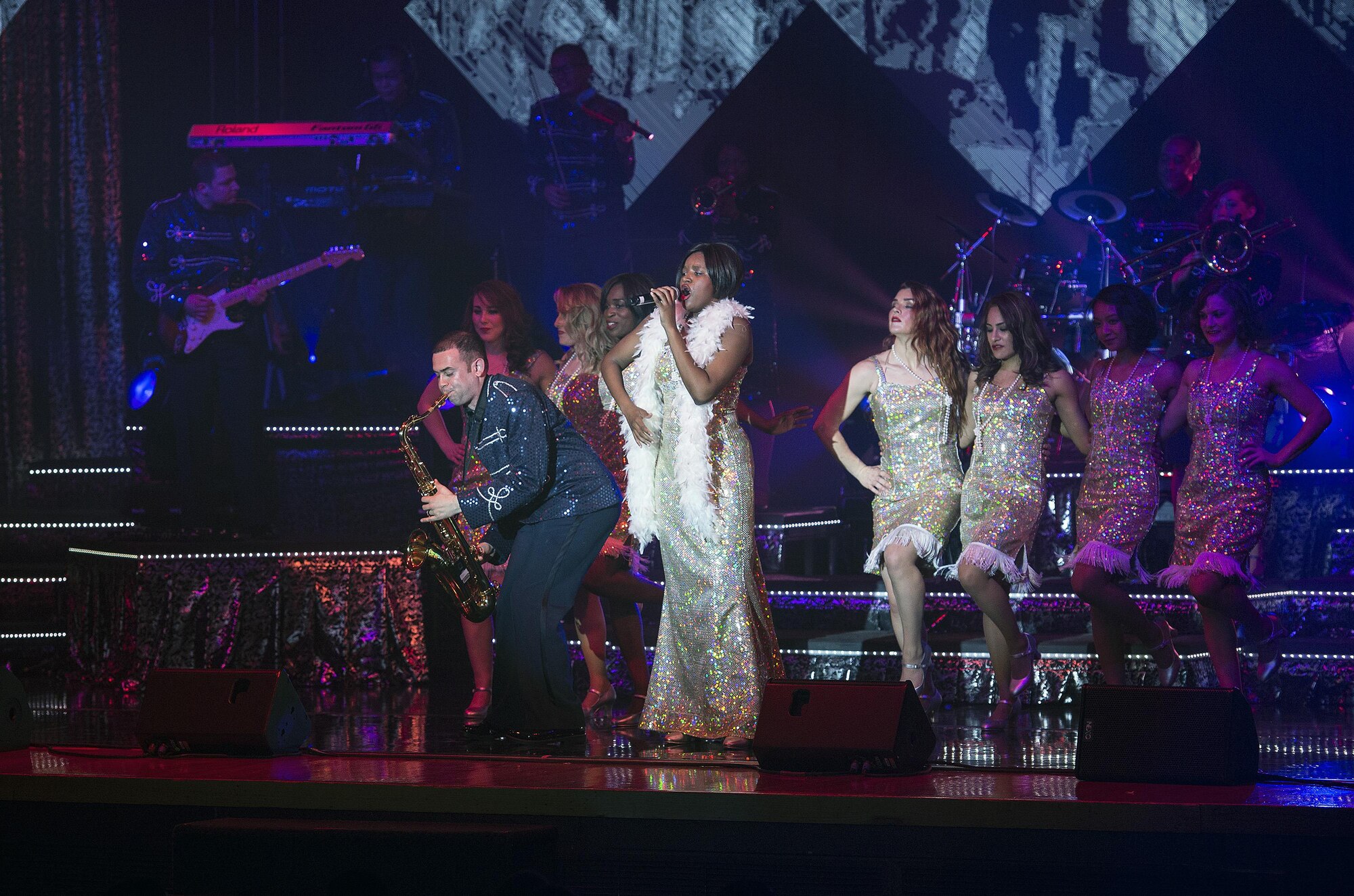 Staff Sgt. Sherita Tisdon leads “Sweet Georgia Brown” while Airman 1st Class Javier Rodriguez plays the saxophone, May 29, at the Bob Hope Theater, Joint Base San Antonio-Lackland, Texas. TIB performed a dress rehearsal of its World Tour 2015 for an audience of basic trainees in preparation for its first performance in Fort Walton Beach, Florida, June 6. This year’s world tour will stop at locations all over the globe. (U.S. Air Force photos/Johnny Saldivar/Released)