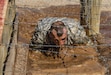 Army Reserve drill sergeant, Staff Sgt. Russell Vidler, 98th Training Division (IET), negotiates the mud obstacle during the third day of competition at the 108th Training Command (IET) combined Best Warrior and Drill Sergeant of the Year competition held at Fort Huachuca, Ariz. Vidler is one of five drill sergeants competing for the top honor in this year's competition. (U.S. Army photo by Sgt. 1st Class Brian Hamilton)