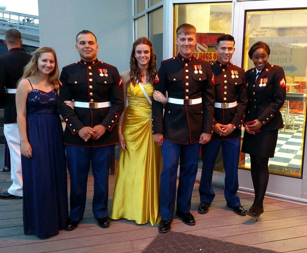 29 May 2015 – (L to R) Bianka Villasenor, PFC Klinedinst, Ashley Poley, LCpl Vandegrift, PFC Freudiger, and Cpl Kronberger pose for a group photo on the observation deck at the USS North Carolina during the Weapons Training Battalion Dining In.