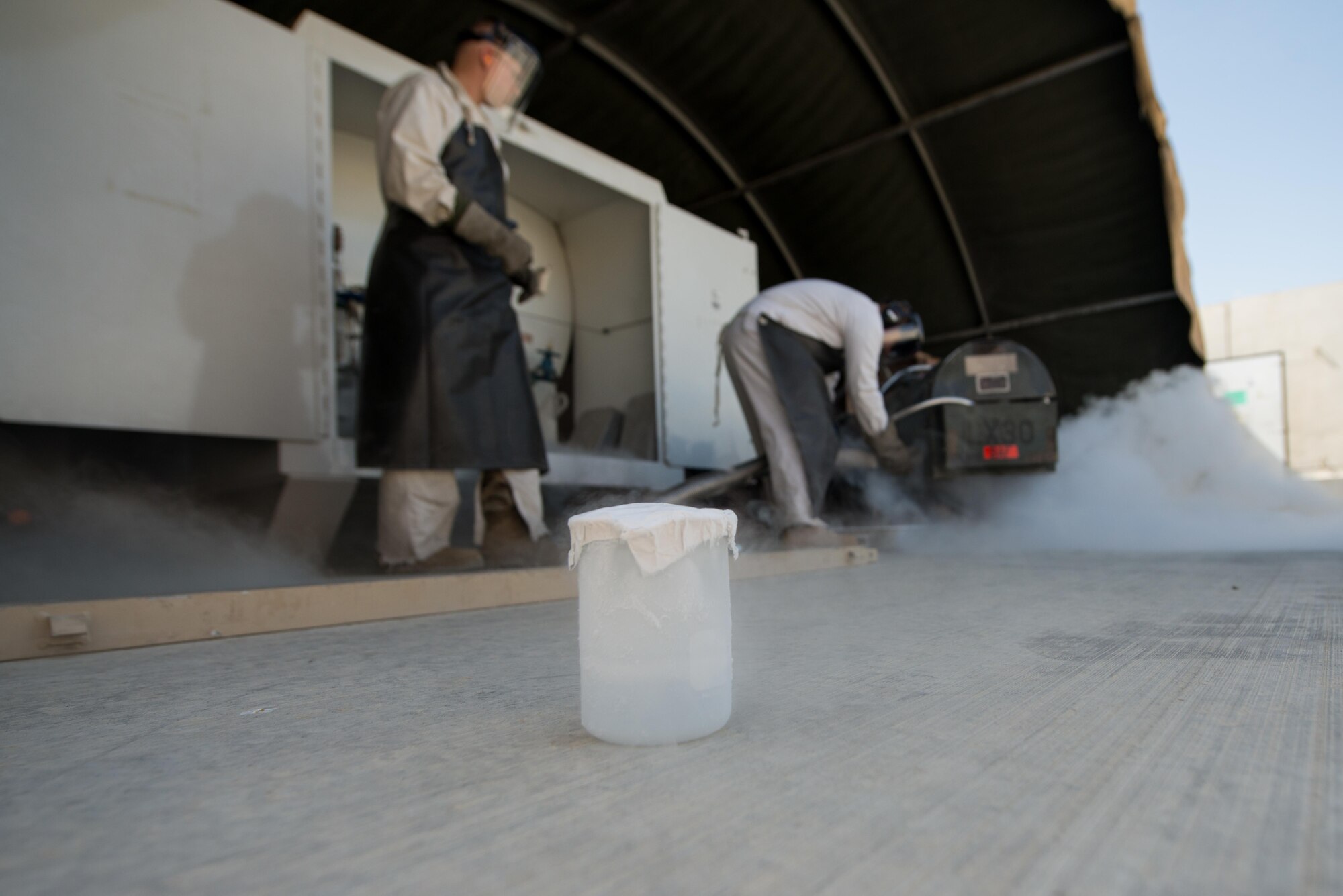U.S. Airmen assigned to the 455th Expeditionary Logistics Readiness Squadron cryogenics shop test the quality of a 50-gallon liquid oxygen (LOX) cart at Bagram Air Field, Afghanistan, May 16, 2015. The cryogenics shop is responsible for supplying, storing and making sure the LOX used at Bagram meets Air Force standards. (U.S. Air Force photo by Tech Sgt. Joseph Swafford/Released)