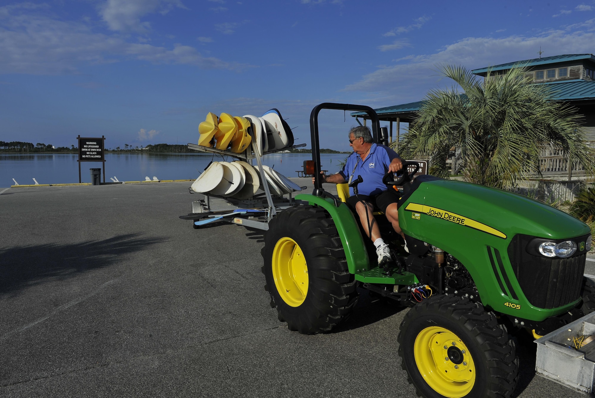 Raymond Stichler, Outdoor Recreation recreational aid, brings stand-up paddle boards and kayaks out of storage for the day at Hurlburt Field, Fla., June 4, 2015. The Outdoor Recreation SUP class is new to Hurlburt Field this year and classes are held Tuesdays and Thursdays from 7:30 a.m. to 8:30 a.m. weekly at the Sound Side. (U.S. Air Force photo/Airman Kai White)