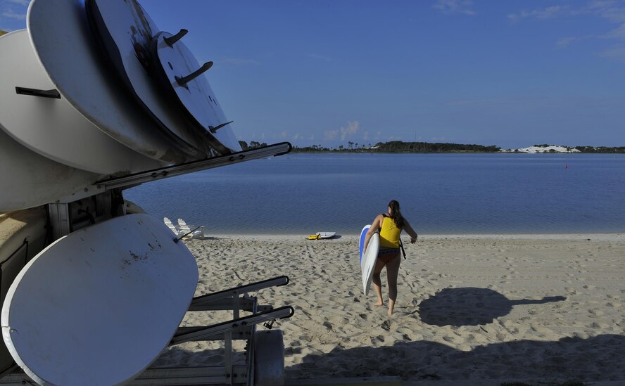 Sara Francis, 1st Special Operations Force Support Squadron visual information specialist, prepares for the morning’s stand-up paddle boarding class at Hurlburt Field, Fla., June 4, 2015. The Outdoor Recreation SUP class is new to Hurlburt Field this year and classes are held Tuesdays and Thursdays from 7:30 a.m. to 8:30 a.m. weekly at the Sound Side. (U.S. Air Force photo/Airman Kai White)