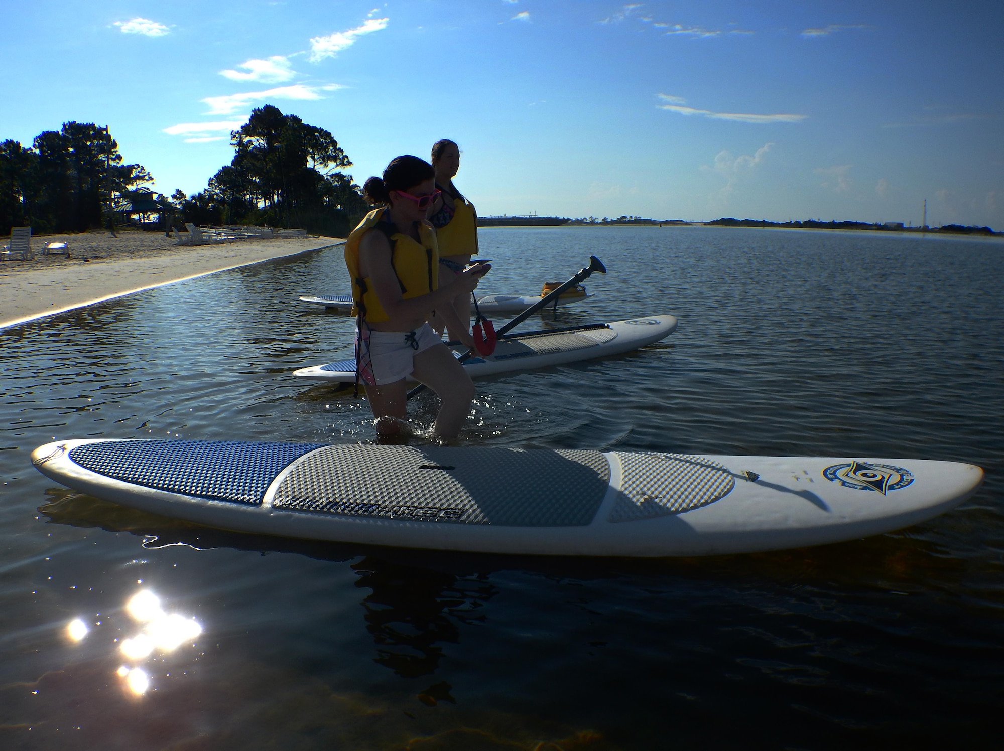 Stephany Pippin, 1st Special Operations Force Support Squadron visual information specialist, leaves shore for the morning’s stand-up paddle boarding class at the Hurlburt Field Sound Side, Fla., June 4, 2015. The Outdoor Recreation SUP class is new to Hurlburt Field this year and classes are held Tuesdays and Thursdays from 7:30 a.m. to 8:30 a.m. weekly at the Sound Side. (U.S. Air Force photo/Airman Kai White)
