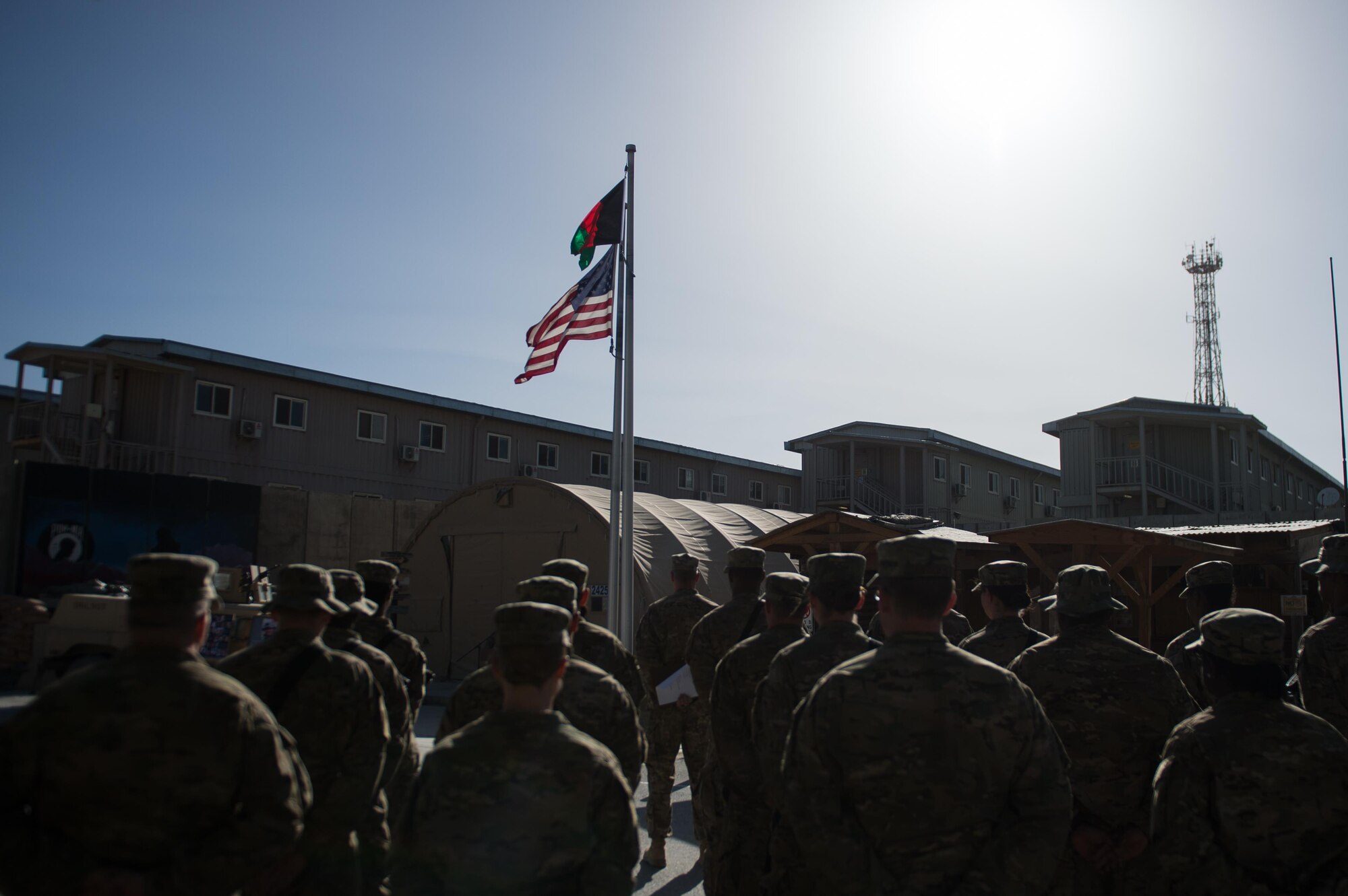 U.S. service members participate in a remembrance ceremony and retreat at Bagram Air Field, Afghanistan, May 26, 2015. The ceremony was held to remember those who gave their lives while deployed to Afghanistan. (U.S. Air Force photo by Tech. Sgt. Joseph Swafford/Released)