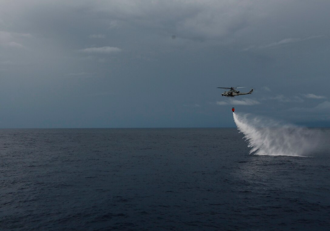 U.S. Marines with Marine Medium Tiltrotor Squadron 161 (Reinforced), 15th Marine Expeditionary Unit, practice firefighting operations in the Philippine Sea, June 3, 2015. Marines of the 15th MEU practice firefighting operations to be prepared for potential missions in the future. (U.S. Marine Corps photo by Sgt. Steve H. Lopez/Released)