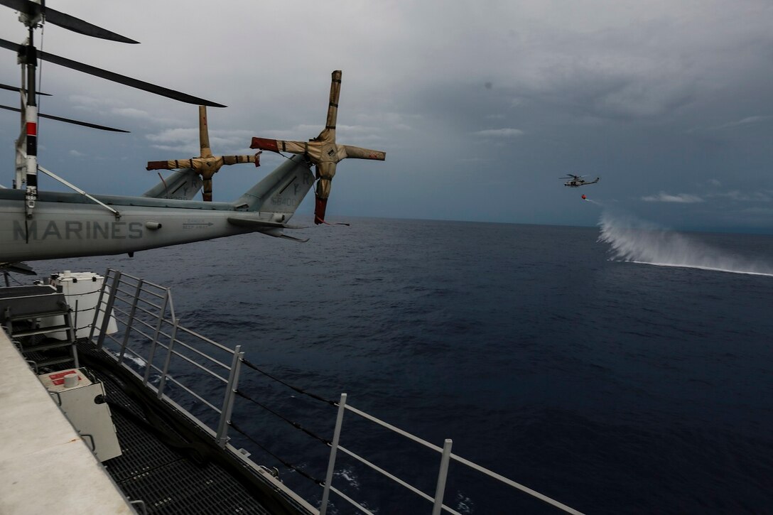 U.S. Marines with Marine Medium Tiltrotor Squadron 161 (Reinforced), 15th Marine Expeditionary Unit, practice firefighting operations in the Philippine Sea, June 3, 2015. Marines of the 15th MEU practice firefighting operations to be prepared for potential missions in the future. (U.S. Marine Corps photo by Sgt. Steve H. Lopez/Released)