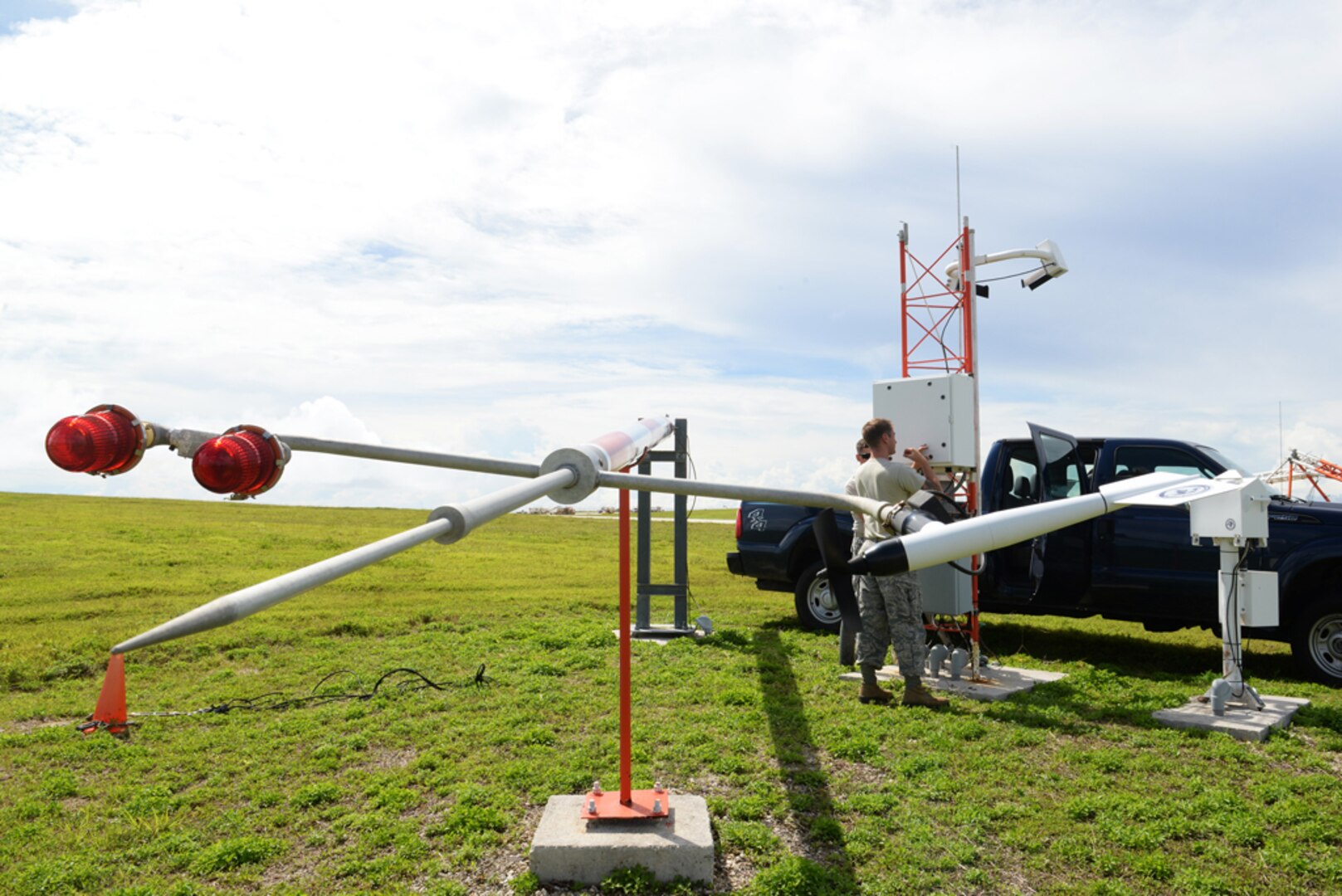 ANDERSEN AIR FORCE BASE, Guam (June 2, 2015) - Airfield systems Airmen from the 36th Operations Support Squadron open a field data collection unit. The technicians check circuits within the unit for arch burns, blown fuses, loose wires and missing parts to ensure life-saving equipment is operational at all times. 