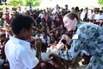 TARAWA, Kiribati (June 8, 2015) - Royal Australian Navy Lt. Emma Thornburn teaches kids proper tooth brushing techniques at the Dai Nippon Primary School in Betio, Kiribati, during Pacific Partnership 2015. The program was offered by host nation and military dental providers from Australia, New Zealand and the U.S. and is one of the many professional knowledge exchanges that are taking place during this year's Pacific Partnership mission. Now in its 10th iteration, Pacific Partnership is the largest annual multilateral humanitarian assistance and disaster relief preparedness mission conducted in the Indo-Asia-Pacific Region. While training for crisis conditions, Pacific Partnership missions have provided medical care to approximately 270,000 patients and veterinary services to more than 38,000 animals. Additionally, Pacific Partnership has provided critical infrastructure development to host nations through the completion of more than 180 engineering projects. 