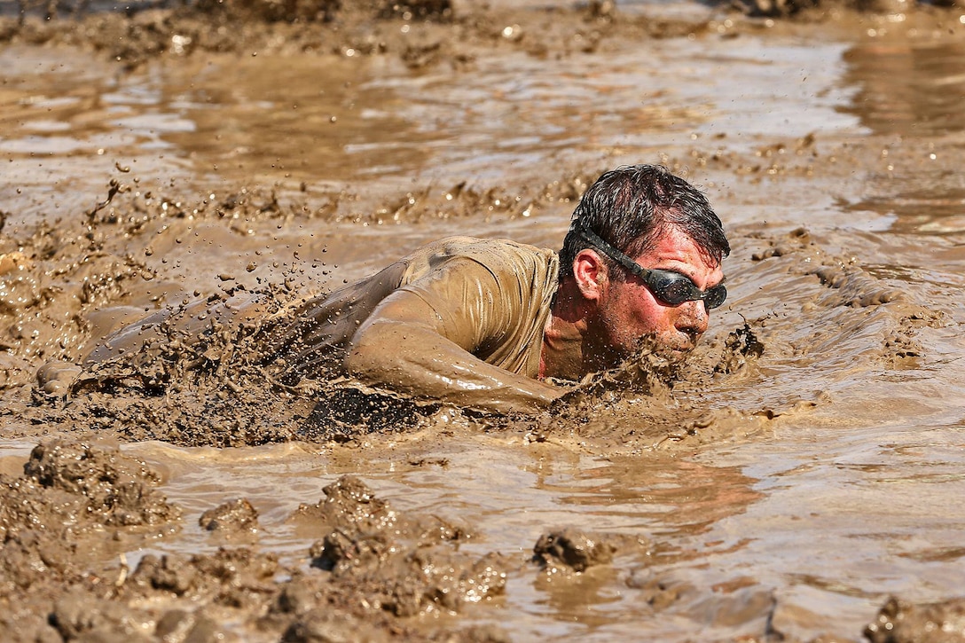 More than 6,000 racers participated in the opening day of the 2015 World Famous Mud Run here, June 6. The Mud Run, open to authorized military and civilian participants, includes a 10k and a 5k option with hills, tire obstacles, river crossings, two 5-foot walls with mud on both sides, a tunnel crawl, a cargo net climb and a final 30-foot long mud pit. The series will also have a 1k kids’ Mud Run for children ages 4 to 12.
