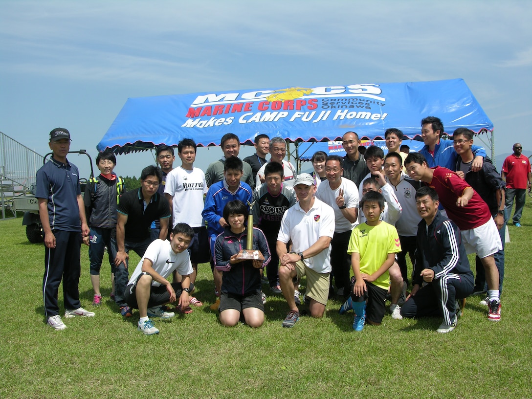 Col Fullwood and the winning JGSDF Fuji Schools Team at the 1st Annual Camp Fuji Sports Tournament pose with the tournament trophy.  JGSDF teams from Fuji Schools, Itazuma, and Takigahara participated in the tournament and competed against each other and against a Camp Fuji Team.  