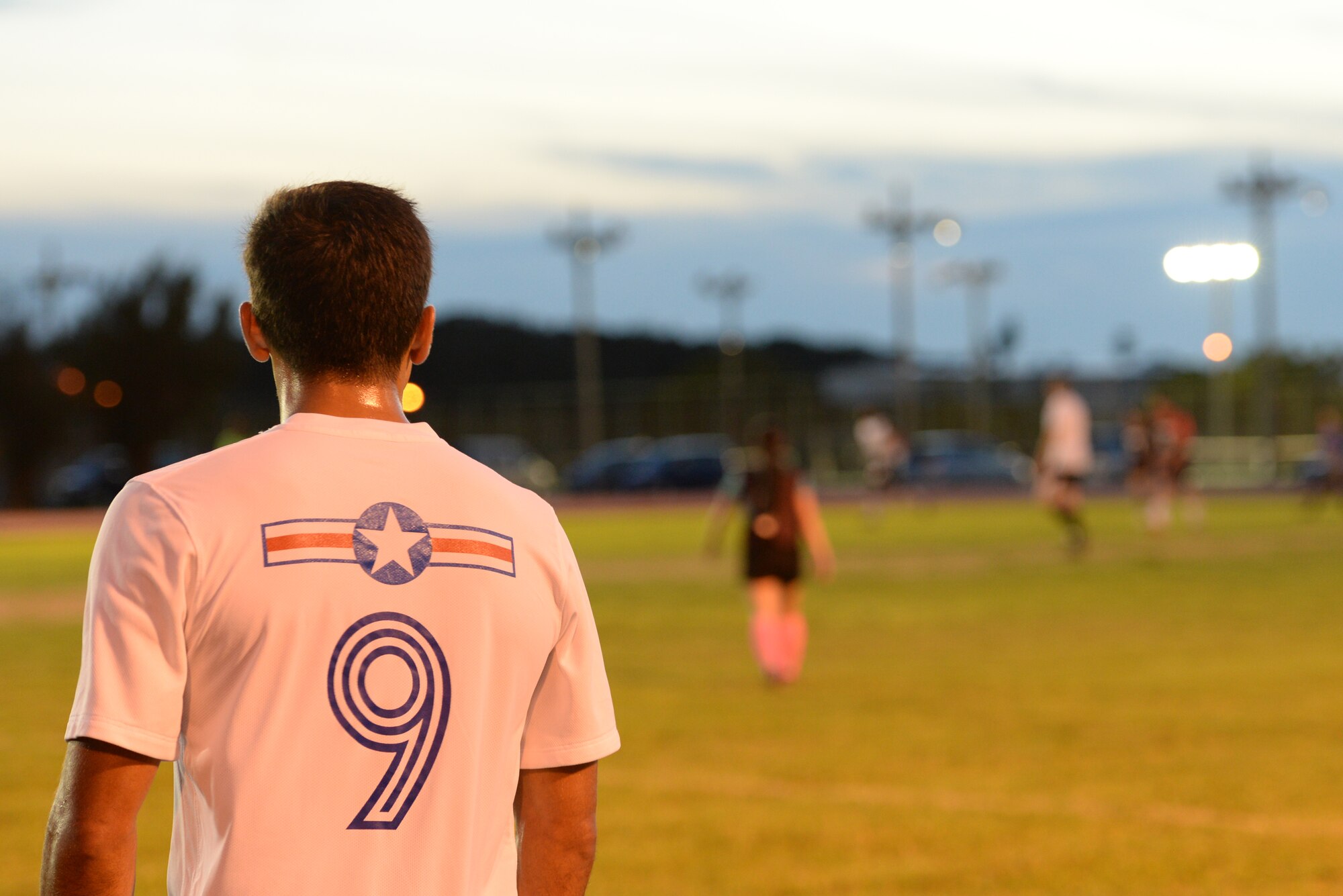 U.S. Air Force 1st Lt. Aaron Zendejas, 961st Airborne Air Control Squadron air battle manager and mid-fielder, watches his team play from the sidelines during an intramural match at the Risner Fitness Center on Kadena Air Base, Japan, June 2, 2015. Zendejas played mid fielder for the U.S. Air Force Men’s Soccer Team during the All Armed Forces Soccer Tournament May 21, 2015. (U.S. Air Force photo by Senior Airman Omari Bernard)