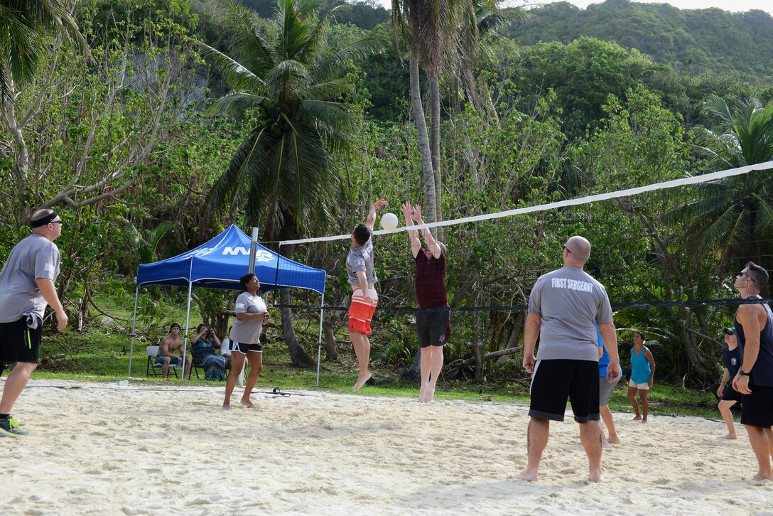 Team Andersen’s commanders compete against the first sergeants during a volleyball tournament June 5, 2015, at Tarague Beach on Andersen Air Force Base, Guam. The first sergeants beat the commanders during the first match of the tournament and won the final match against the First Four Airmen. (U.S. Air Force photo by Airman 1st Class Arielle Vasquez/Released)