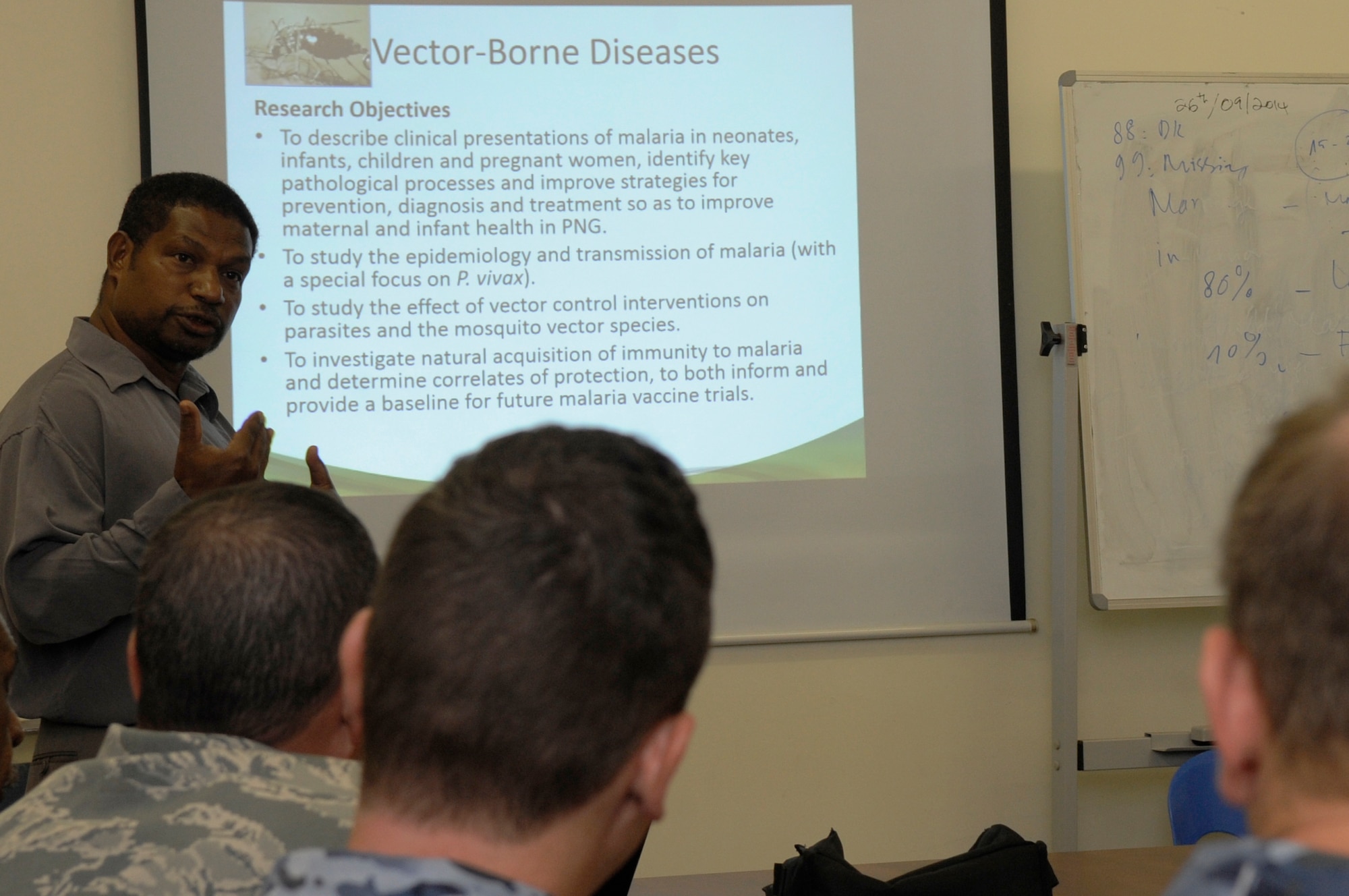 Dr. William Pomat, head of the Papua New Guinea Institute of Medical Research, Infection and Immunology Unit, gives military doctors and researchers from the U.S., Australia, Philippines, Indonesia and Papua New Guinea an overview of vector-borne diseases in the country. He also highlighted what the institute has accomplished over the years during Pacific Angel 15-4 at Goroka, Papua New Guinea, June 4, 2015. Mountains, jungle and large bodies of water make monitoring, treating and eradicating tropical disease difficult. Efforts undertaken during Pacific Angel help multilateral militaries in the Pacific improve and build relationships across a wide spectrum of civic operations, which bolsters each nation???s capacity to respond and support future humanitarian assistance and disaster relief operations. (U.S. Air Force photo by Staff Sgt. Marcus Morris/Released)