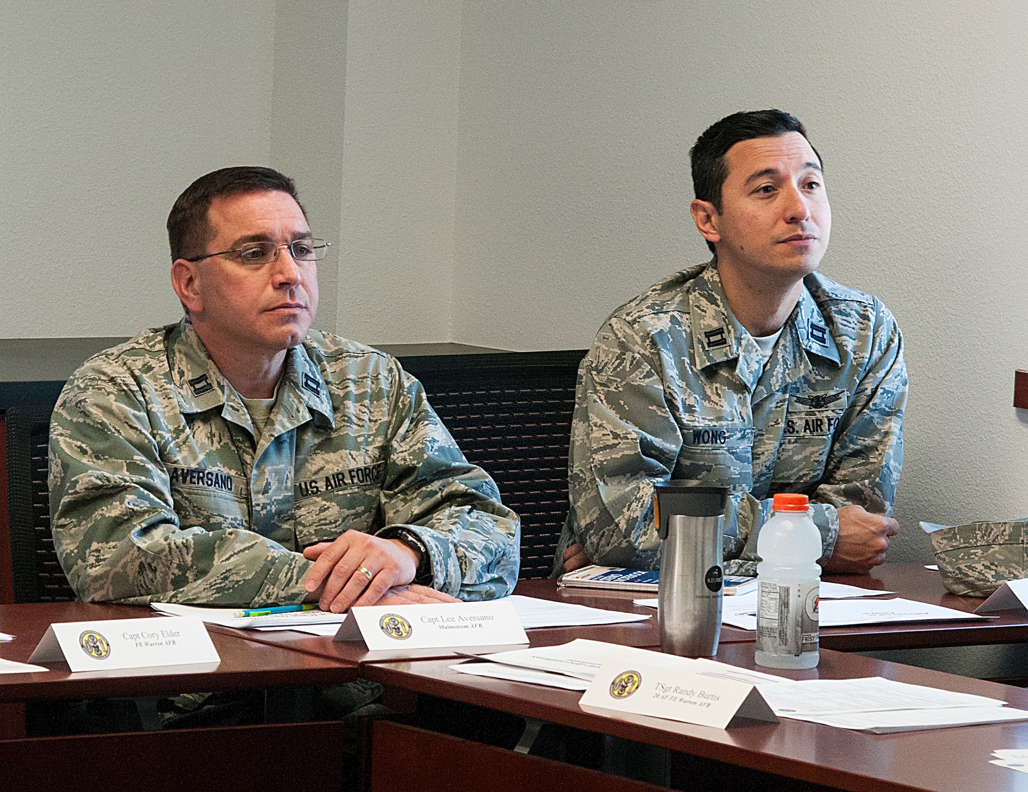 Captain Lee Aversano, 10th Missile Squadron instructor, Malmstrom Air Force Base, Mont., and Capt. Armand Wong, 532nd Training Squadron instructor, Vandenberg Air Force Base, Calif., listen to a briefing during the Advanced ICBM Course June 8, 2015, in the 20th Air Force ICBM Center of Excellence, F.E. Warren Air Force Base, Wyo. Airmen from missile, maintenance and security forces career fields, attended the course to obtain more in-depth knowledge of the nuclear deterrence mission. (U.S. Air Force photo by Senior Airman Jason Wiese)
