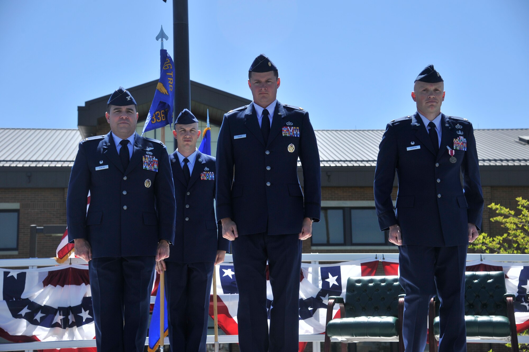 Maj. Timothy Dalby, the 336th Training Support Squadron commander, stands center as the newest 336th TRSS commander next to Col. Jonathan Duncan, 336th Training Group commander, left, and the outgoing 336th TRSS commander, Lt. Col. Kelly Hannum, June 5, 2015, at Fairchild Air Force Base, Wash. Dalby will lead the squadron for the next two years to help provide quality support to achieve the 336th mission “to safely prepare America’s aircrews for global survivability anytime, anywhere and return with honor.” (U.S. Air Force photo/ Airman 1st Class Taylor Bourgeous)