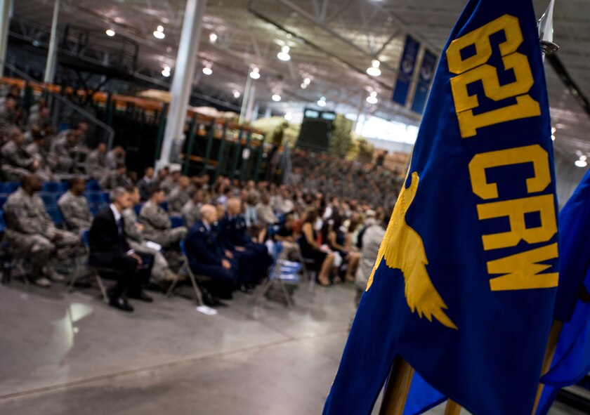 Members of the 621st Contingency Response Wing and guests attend the final reorganization ceremony June, 4, 2015, at Travis Air Force Base, Calif.  Throughout the week, eight units inactivated, five units activated, and two units realigned. Travis will now host the newly activated 821st Contingency Response Group and the 621st Air Mobility Advisory Group. (U.S. Air Force photo/Staff Sgt. Gustavo Gonzalez) 
