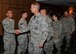 Colonel Derek C. France, 325th Fighter Wing commander, and members of Team Tyndall congratulate the June promotees May 29. (U.S. Air Force photo by Airman 1st Class Sergio A. Gamboa/Released)
