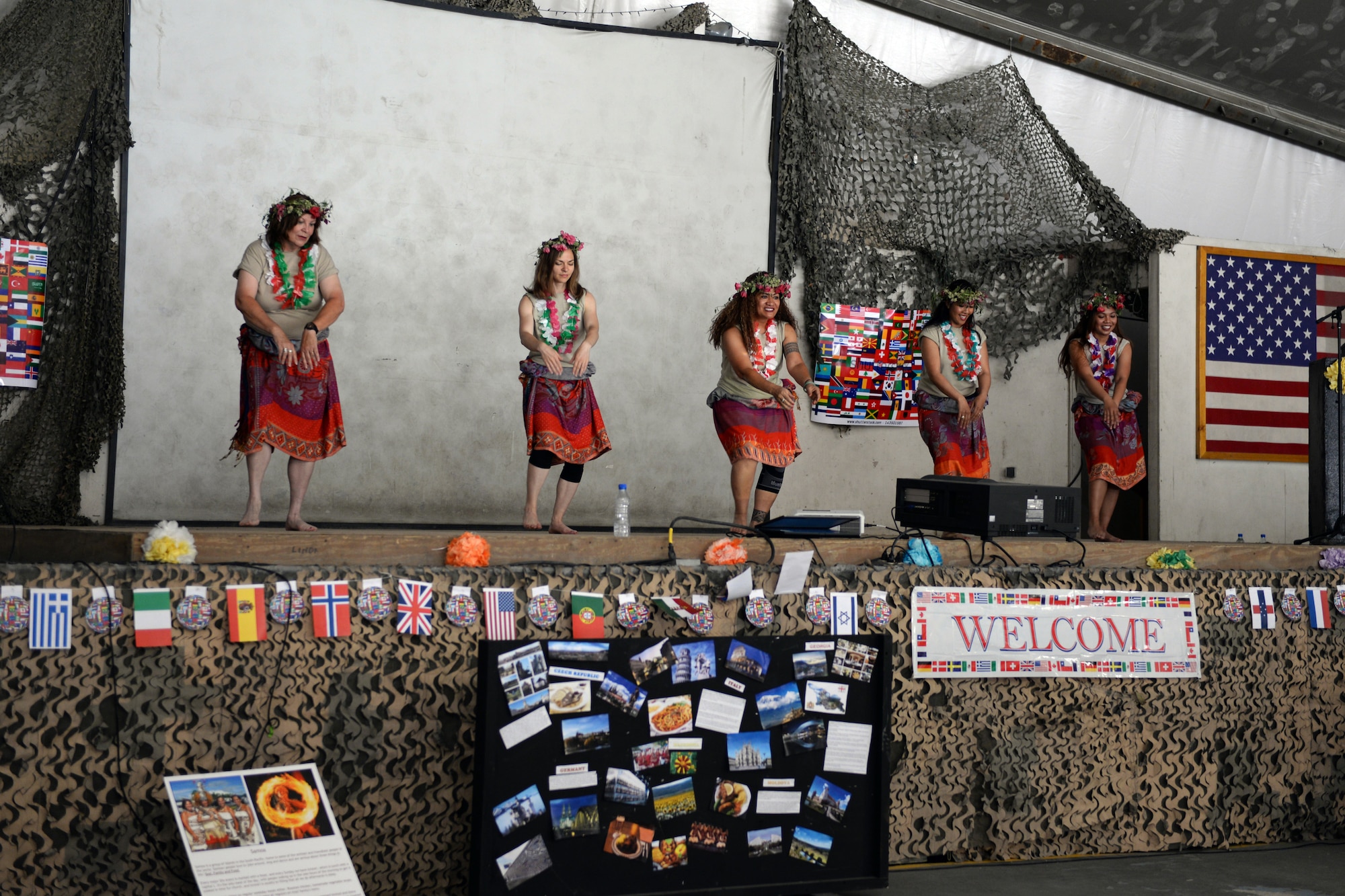 Members of a local dance group perform a native dance during the Bagram culture day event May 5, 2015, at Bagram Air Field, Afghanistan. The event was attended by members of many different backgrounds, as well as service members from all U.S. branches of service and members of the Czech Republic and Georgian military. (U.S. Air Force photo by Senior Airman Cierra Presentado/Released)