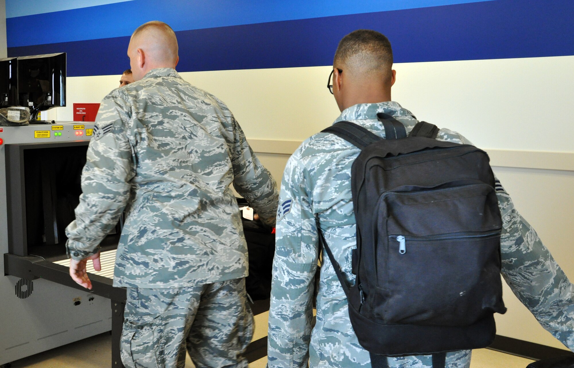 Members of the 931st Air Refueling Group make their way through the passenger terminal on their way to board an aircraft for a deployment from McConnell Air Force Base, Kan.  Several members of the 931 ARG have deployed to Southwest Asia.  (U.S. Air Force photo by Capt. Zach Anderson)