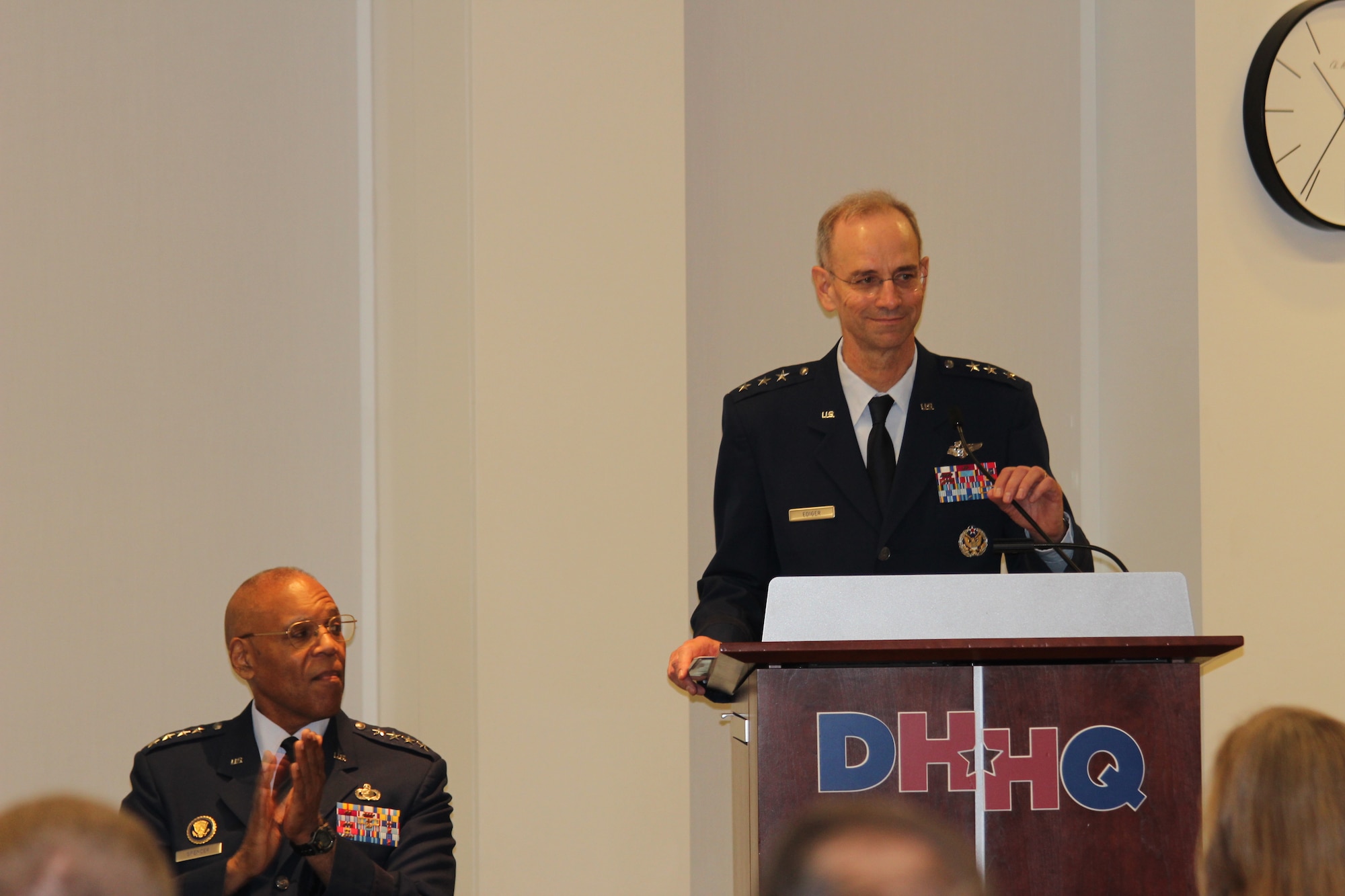 Vice Chief of Staff Gen. Larry O. Spencer, applauds new Air Force Surgeon General, Lt. Gen. Mark A. Ediger, during his promotion ceremony remarks June 8 at the Defense Health Headquarters, Falls Church, Va.   (U.S. Air Force photo by Jonathan Stock.)   
