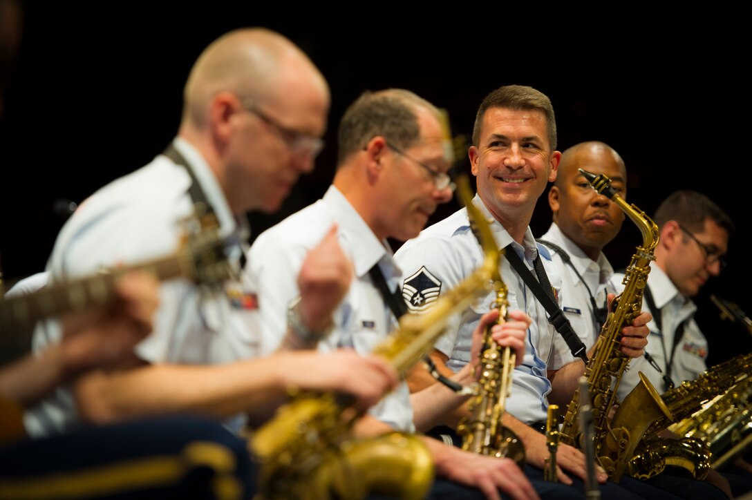Master Sgt. Tyler Kuebler, Airmen of Note music director, watches as another musician performs a solo during the Great American Brass Band Festival at the Norton Center for the Arts in Danville, Ky., June 5, 2015. This year marks the first time the Airmen of Note have performed at the GABBF. (U.S. Air Force photo by Staff Sgt. Chad C. Strohmeyer)(Released)