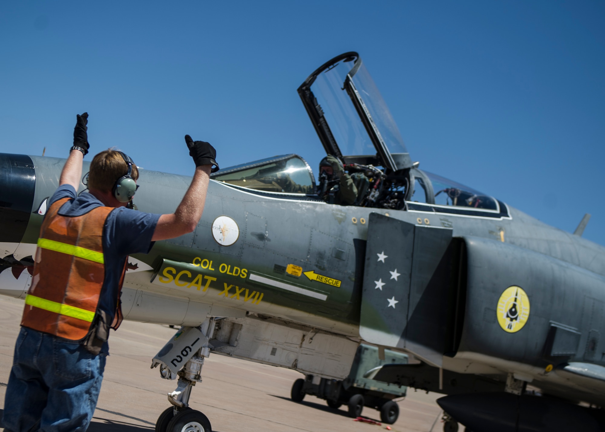 Lieutenant Col. Ronald King, 82nd Aerial Target Squadron, Detachment 1 commander and Mike Fogle, QF-4 Drone mechanic, go through a pre-flight checklist June 3, 2015 at Holloman Air Force Base, N.M. King flew his first solo flight in the QF-4 Drone on June 3, making him the last pilot who will ever learn to fly the QF-4. At Holloman, QF-4s can be flown either manned or unmanned and are used as remotely controlled unmanned targets for air-to-air and ground-to-air weapons systems evaluations, development and testing.  (U.S. Air Force photo by Airman 1st Class Emily A. Kenney/Released)