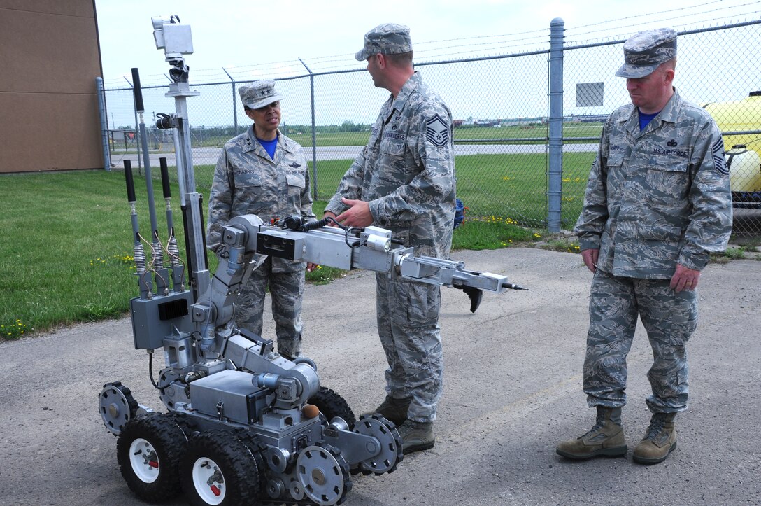 Maj. Gen. Stayce Harris, commander, 22nd Air Force and with Chief Master Sgt. Michael Thorpe, 22nd Air Force Command Chief speak with Senior Master Sgt. Keith Hartloff, superintendent, 914th Civil Engineer Squadron Explosive Ordnance Disposal at Niagara Falls Air Reserve Station on June 6, 2015. Harris toured the installation and visited with Airmen across the Wing. (U.S. Air Force photo by Staff Sgt. Matthew Burke)