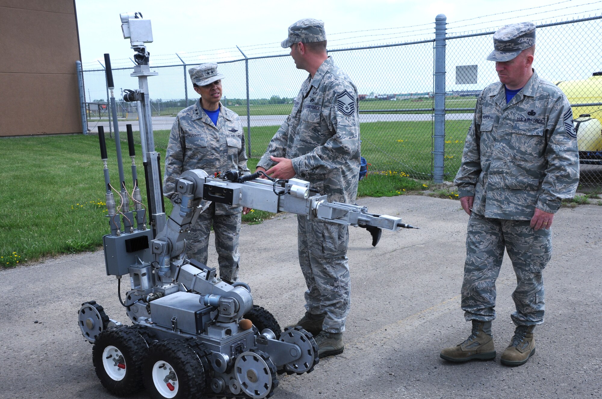 Maj. Gen. Stayce Harris, commander, 22nd Air Force and with Chief Master Sgt. Michael Thorpe, 22nd Air Force Command Chief speak with Senior Master Sgt. Keith Hartloff, superintendent, 914th Civil Engineer Squadron Explosive Ordnance Disposal at Niagara Falls Air Reserve Station on June 6, 2015. Harris toured the installation and visited with Airmen across the Wing. (U.S. Air Force photo by Staff Sgt. Matthew Burke)
