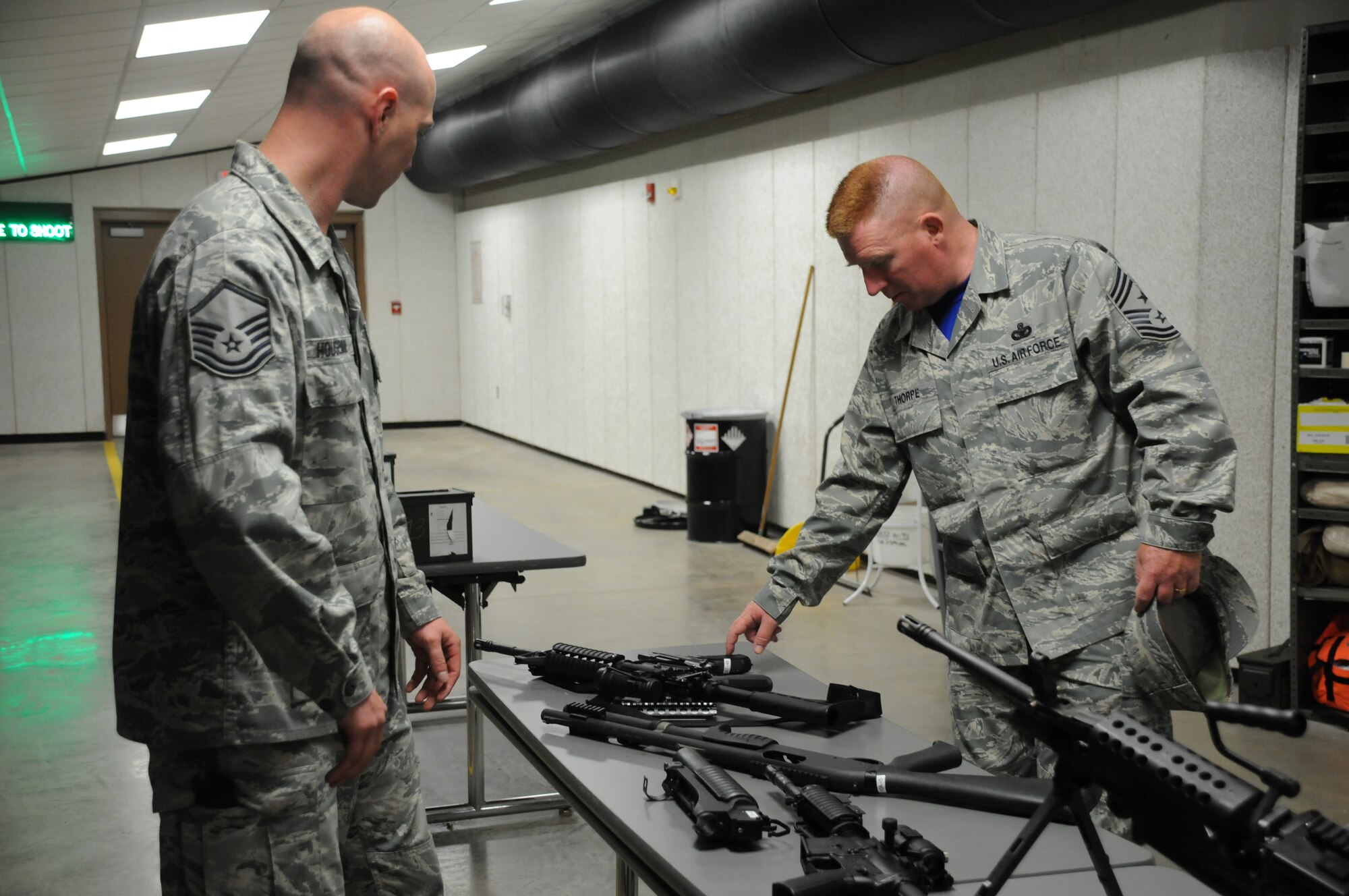 Chief Master Sgt. Michael Thorpe, 22nd Air Force Command Chief receives a weapons brief from Master Sgt. Stephen Houseman, noncommissioned officer in charge, 914 Security Forces Squadron Combat Arms Training and Maintenance, at Niagara Falls Air Reserve Station on June 6, 2015. Thorpe toured the installation with Maj. Gen. Stayce Harris 22nd Air Force Commander and visited with Airmen across the Wing. (U.S. Air Force photo by Tech. Sgt. Stephanie Sawyer)  
