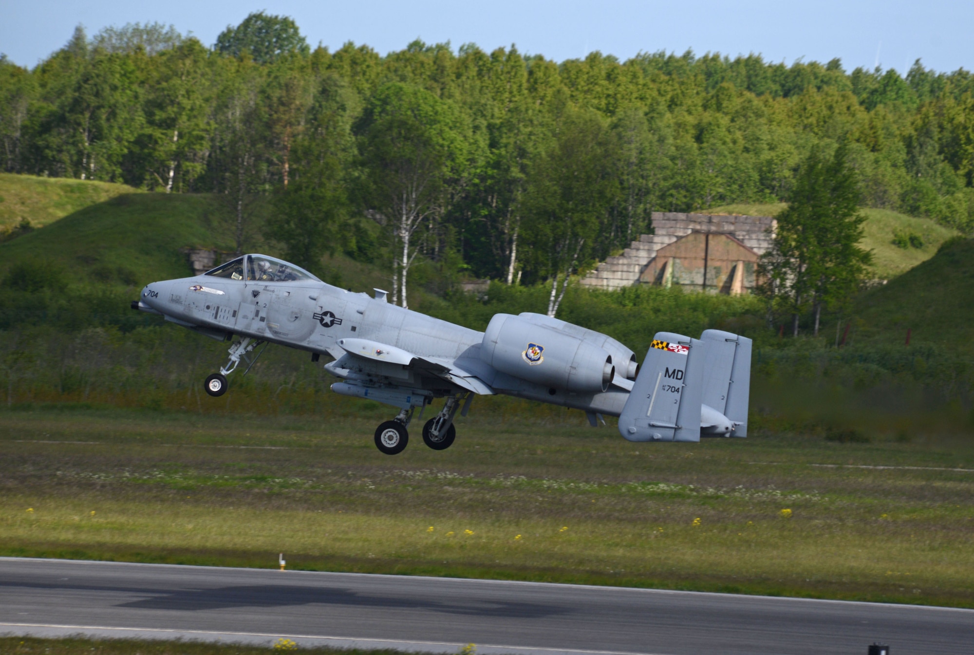 An A-10C Thunderbolt II assigned to the104th Fighter Squadron, Maryland Air National Guard, takes off for a training mission during Saber Strike 15 from Ämari Air Base, Estonia, June 8, 2015. Saber Strike is an exercise that aims to continue to improve U.S. interoperability with ally and partner nations, while increasing their capacity to conduct a full spectrum of military operations. (Air National Guard photo by Tech. Sgt. Christopher Schepers)