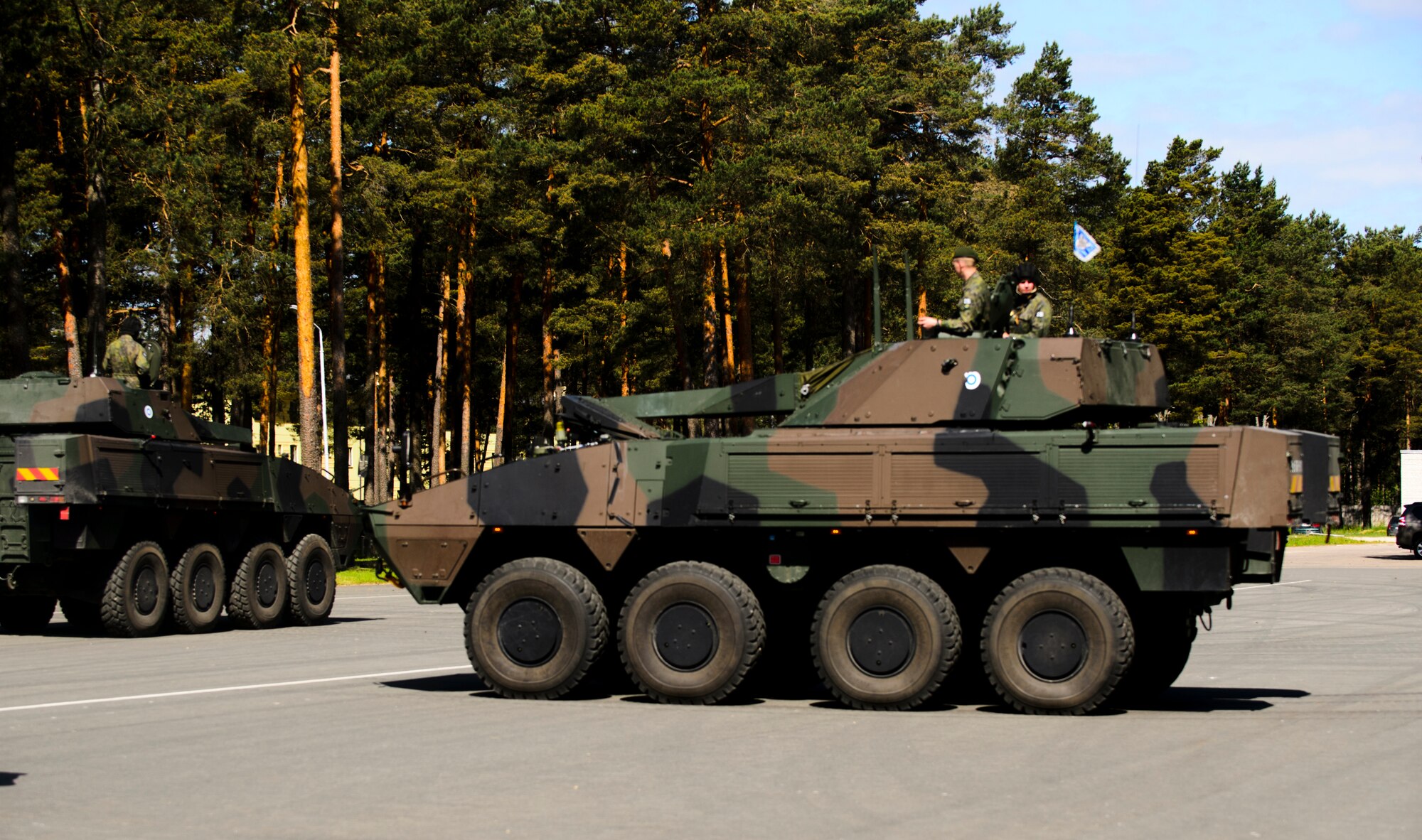 Finish military vehicles leave the opening ceremony at June 8, 2015, Adazi Training Area, Latvia. More than 6,000 service members are participating in Saber Strike 15 an annual multinational exercise designed to strengthen and develop interoperability and friendships between Baltic Area regions and NATO members to ensure regional security. (U.S. Air Force photo/ Staff Sgt. Armando A. Schwier-Morales)