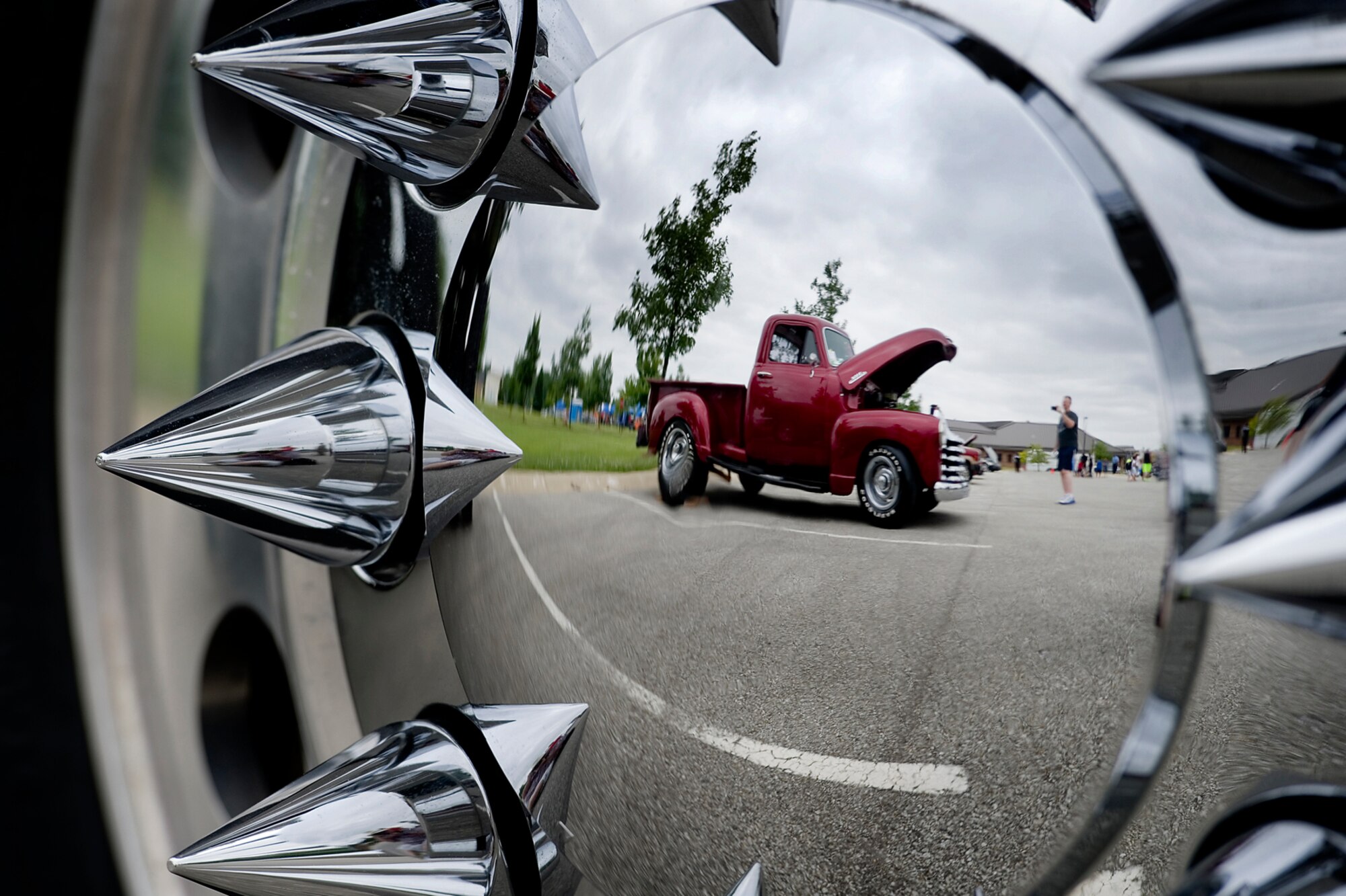 Master Sgt. Roy Goins, 434th Maintenance Squadron nondestructive inspection craftsman, takes a photo of a classic truck during a car show held at Grissom Air Reserve Base, Ind., June 6, 2015. Families had an opportunity to learn about the base, its mission as well as participate in some morale building fun. (U.S. Air Force photo/Tech. Sgt. Douglas Hays)