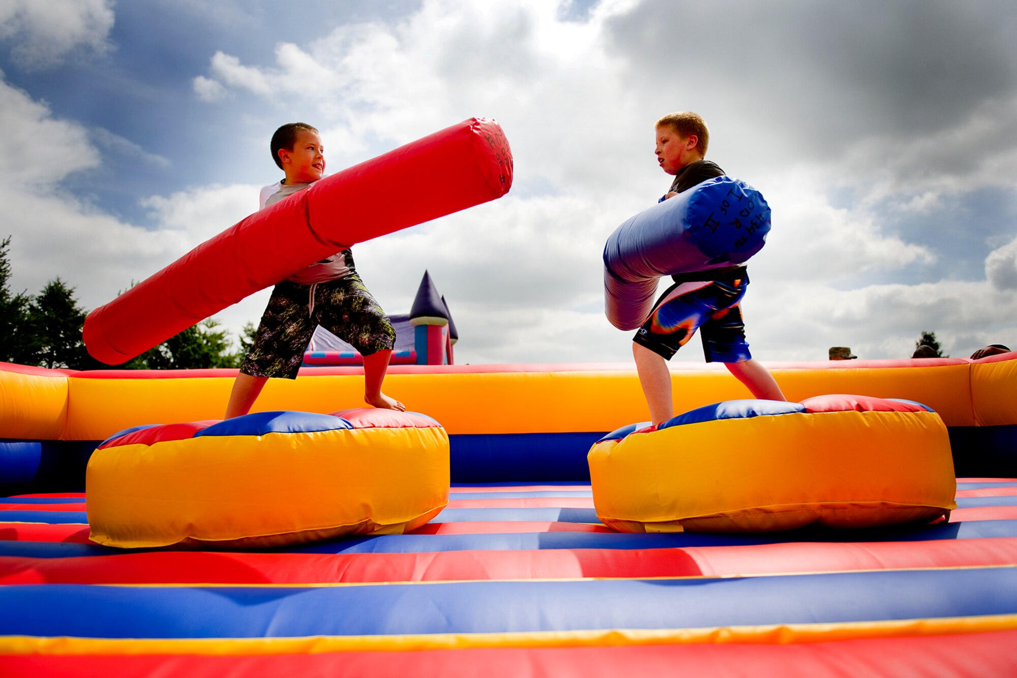 Alex, right, and Jayden Judson, sons of Tech. Sgt. Mike Judson, 434th Logistics Readiness Squadron special purpose vehicle mechanic, joust during the family day picnic at Grissom Air Reserve Base, Ind., June 6, 2015. Family members had a chance to see what their loved ones do at Grissom and to enjoy an afternoon of fun and festivities. (U.S. Air Force photo/Tech. Sgt. Douglas Hays)