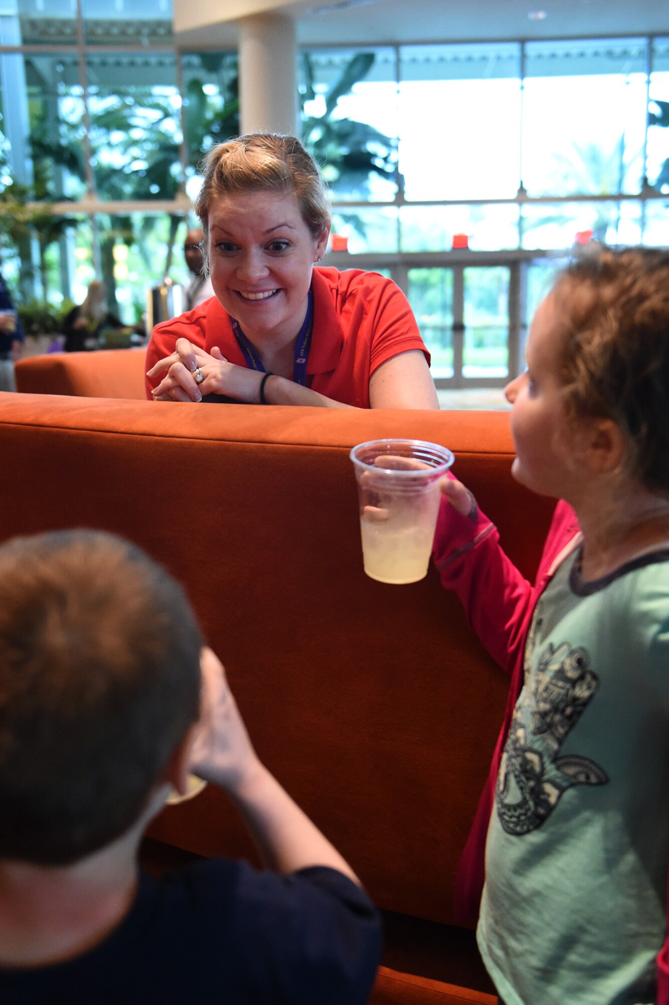 Second Lt. Stephanie Creel, 434th Air Refueling Wing Yellow Ribbon Reintegration Program representative, interacts with children attending a Yellow Ribbon event in Orlando, Fla., March 28, 2015. The program's purpose is to ensure support and outreach services are readily available to unit members, their families and communities throughout a deployment cycle. (U.S. Air Force photo/Tech. Sgt. Mark Orders-Woempner)