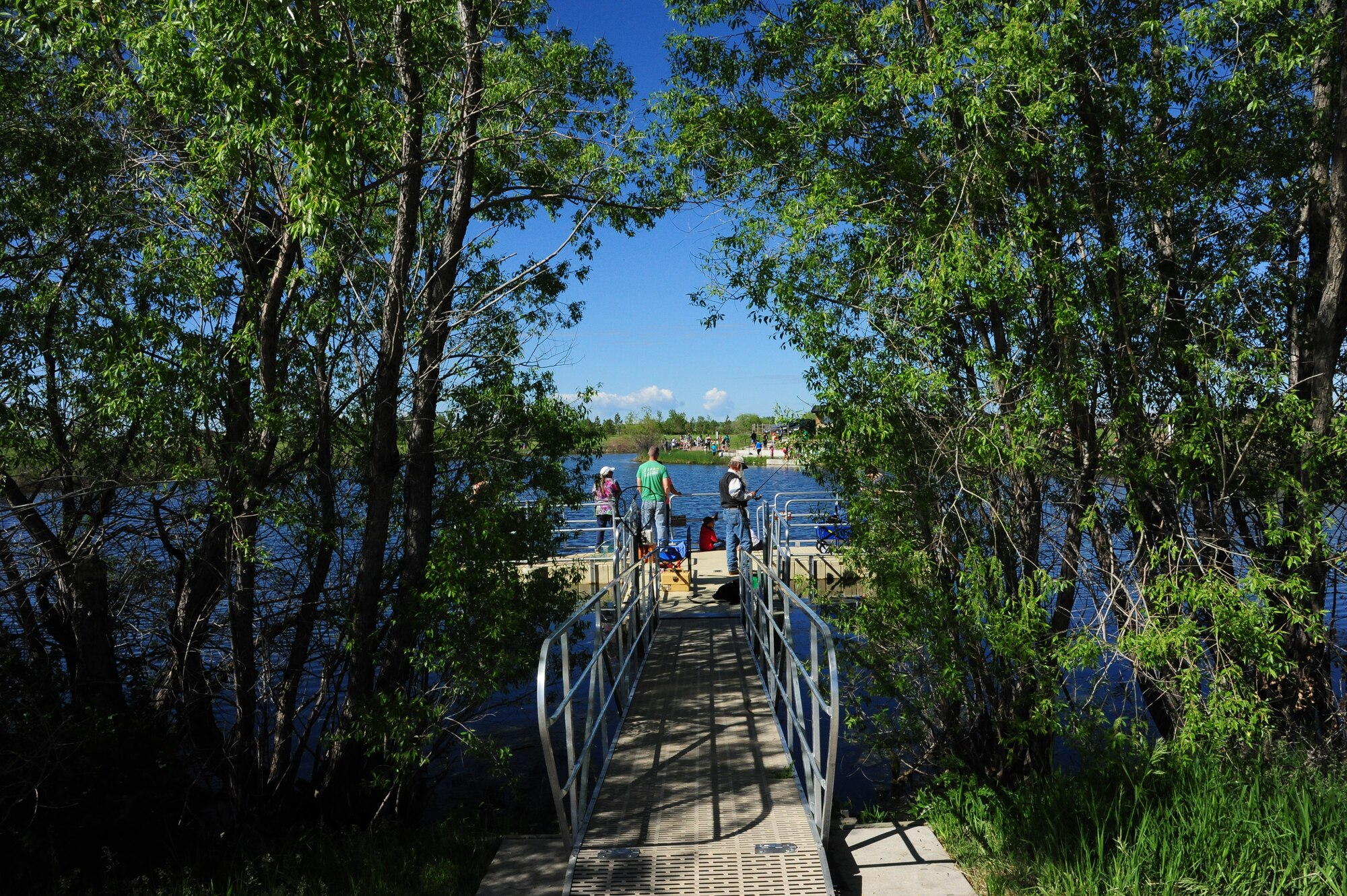 Team Malmstrom members participate in National Fishing and Boating Week, Jun. 6, 2015, at Pow Wow Park, Malmstrom Air Force Base, Mont.  During Kids Fishing Day the pond was stocked by the U.S. Fish and Wildlife Service with 12 inch and larger trout, as well as three to five pound rainbow trout. (U.S. Air Force photo/2nd Lt. Annabel Monroe)