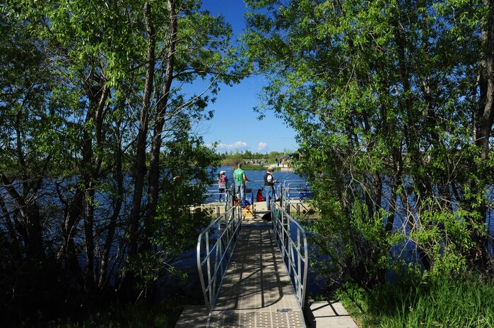 Team Malmstrom members participate in National Fishing and Boating Week, Jun. 6, 2015, at Pow Wow Park, Malmstrom Air Force Base, Mont.  During Kids Fishing Day the pond was stocked by the U.S. Fish and Wildlife Service with 12 inch and larger trout, as well as three to five pound rainbow trout. (U.S. Air Force photo/2nd Lt. Annabel Monroe)