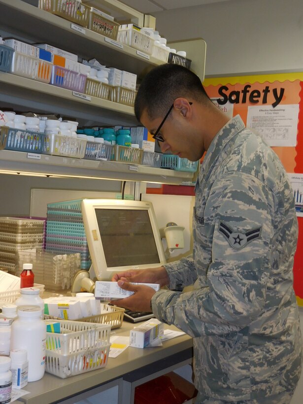 "I love being a Pharmacy Technician in the U.S. Air Force because I get to coordinate patient care with the doctors and also get the opportunity to interact with the patients," said Airman 1st Class Christopher Barta, 779 Medical Support Squadron, Pharmacy Technician. (AF Photo by Kathleen Canfield, 779 MDG)