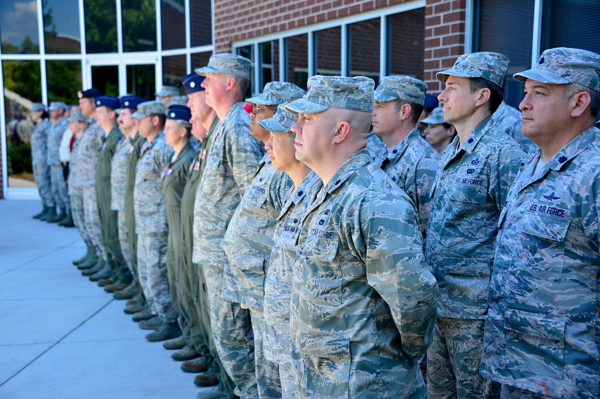 MCGHEE TYSON AIR NATIONAL GUARD BASE, Tenn. - Officers studying with Air War College at the I.G. Brown Training and Education Center here June 4, 2015, form up with NCO academy students , instructors and the Commander, among other guests and staff, for the day's afternoon retreat. The officers arrived here this week in AWC's fourth seminar on campus for Air National Guard and Air Force Reserve Command officers, as well as one Marine Corps officer. (U.S. Air National Guard photo by Master Sgt. Mike R. Smith/Released)  