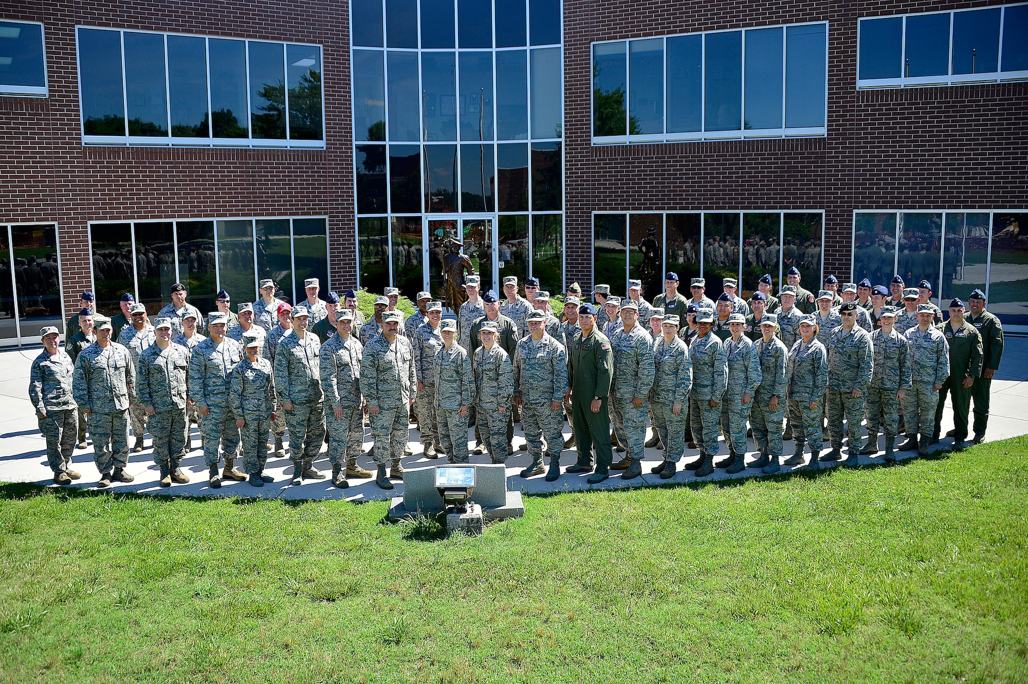 MCGHEE TYSON AIR NATIONAL GUARD BASE, Tenn. - More than 60 lieutenant colonels studying with the Air War College seminar at the I.G. Brown Training and Education Center here, June 4, 2015, form up outside Patriot Hall for their group photos. The officers were part of the AWC's fourth seminar on campus for the Air National Guard and Air Force Reserve Command, which included one Marine Corps officer in attendance. (U.S. Air National Guard photo by Master Sgt. Mike R. Smith/Released) 