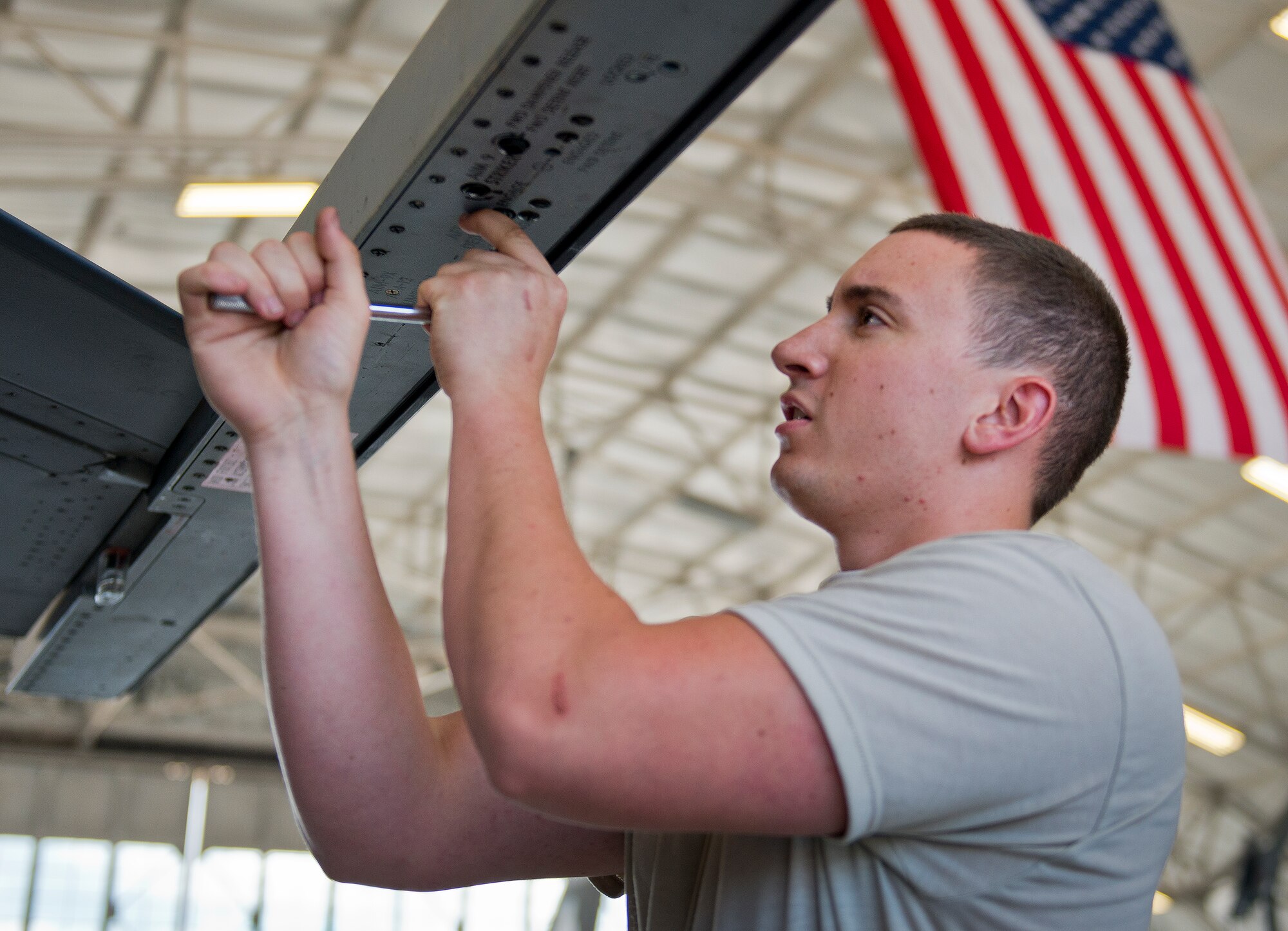Senior Airmen Trey Riley, 96th Aircraft Maintenance Squadron Blue, prepares an F-16 Fighting Falcon for weapons during the second quarter load crew competition June 5 at Eglin Air Force Base, Fla.  The blue team lost the competition to the Red A-10 Thunderbolt II team that consisted of loading the missile and two BDU-50s.  (U.S. Air Force photo/Samuel King Jr.)