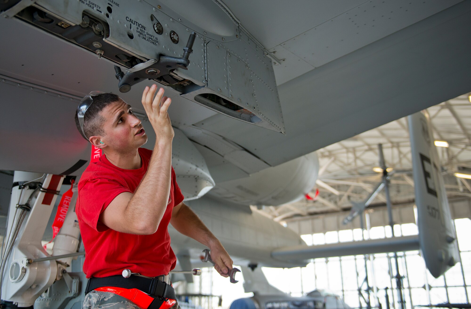 Airman 1st Class James Schmeits, 96th Aircraft Maintenance Squadron Red, secures an AIM-9 to an A-10 Thunderbolt II during the second quarter load crew competition June 5 at Eglin Air Force Base, Fla.  This was the first time in many years the Red team used an A-10 as their weapons load aircraft.  The Red team won the competition against the Blue F-16 Fighting Falcon team.  (U.S. Air Force photo/Samuel King Jr.)