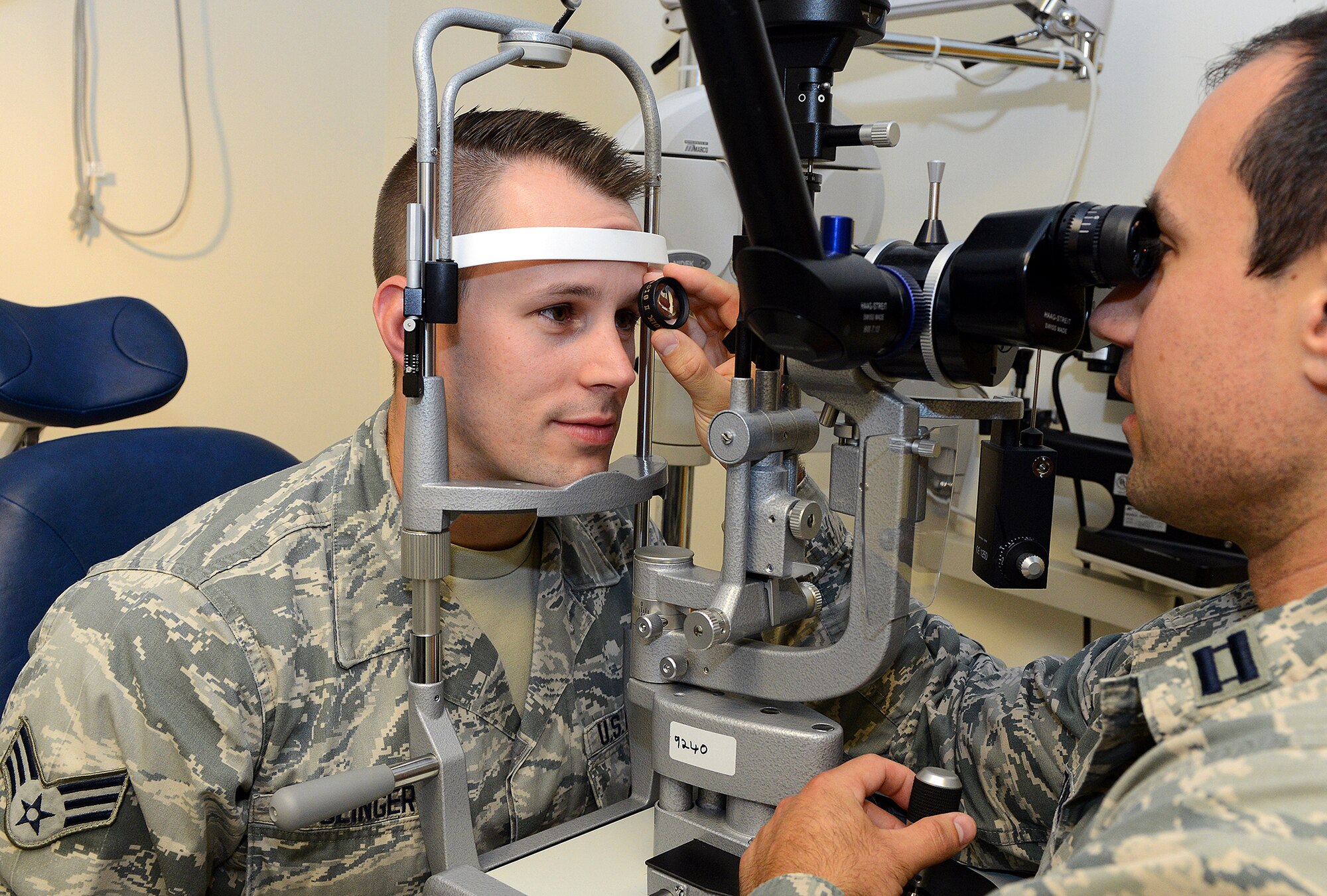 Senior Airman Derek Clinger receives an eye exam from Capt. Mathew Tholl, 78th Medical Group optometrist, at the optometry clinic here. The Optometry Clinic's acute care services are available to patients on a self-referral basis or by referral through their primary care manager or other medical provider for complex or urgent conditions. (U.S. Air Force photo by Tommie Horton) 