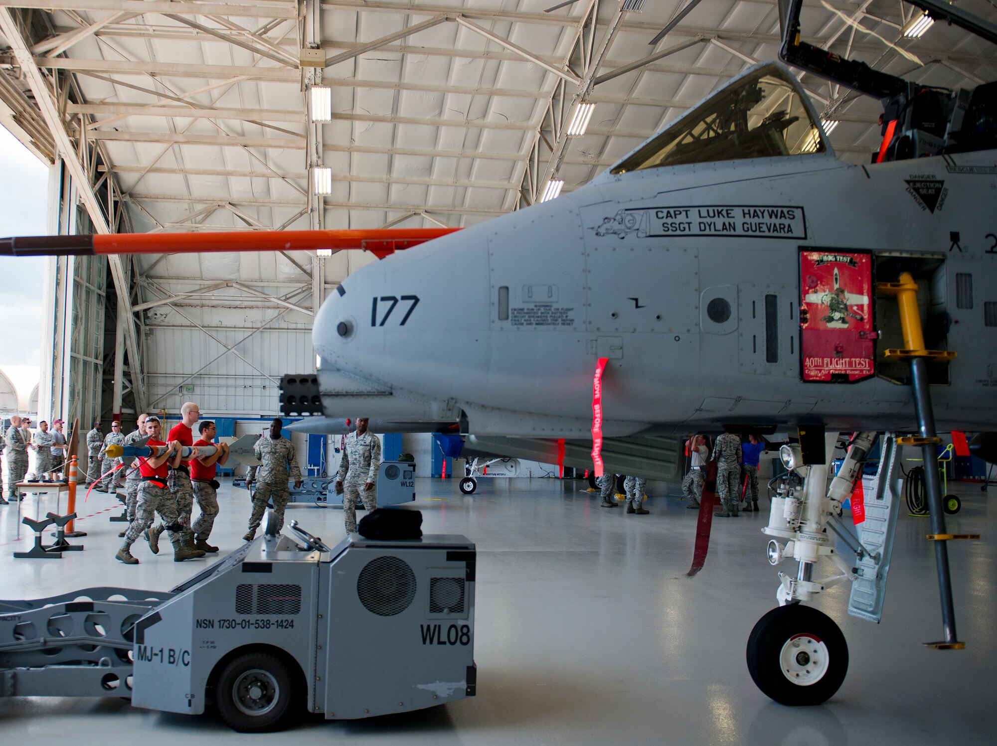 The 96th Aircraft Maintenance Squadron Red team carries an AIM-9 toward their A-10 Thunderbolt II during the second quarter load crew competition June 5 at Eglin Air Force Base, Fla.  This was the first time in many years the Red team used an A-10 as their weapons load aircraft.  The Red team won the competition against the Blue F-16 Fighting Falcon team.  (U.S. Air Force photo/Samuel King Jr.)