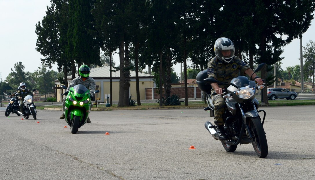 Turkish and American forces navigate an obstacle in a basic rider course demonstration during a Motorcycle Safety Fun Day June 5, 2015, at Incirlik Air Base, Turkey. The BRC demonstration was part of a day of events to celebrate the 60th anniversary of the Turkish American partnership. (U.S. Air Force photo by Staff Sgt. Caleb Pierce/Released)