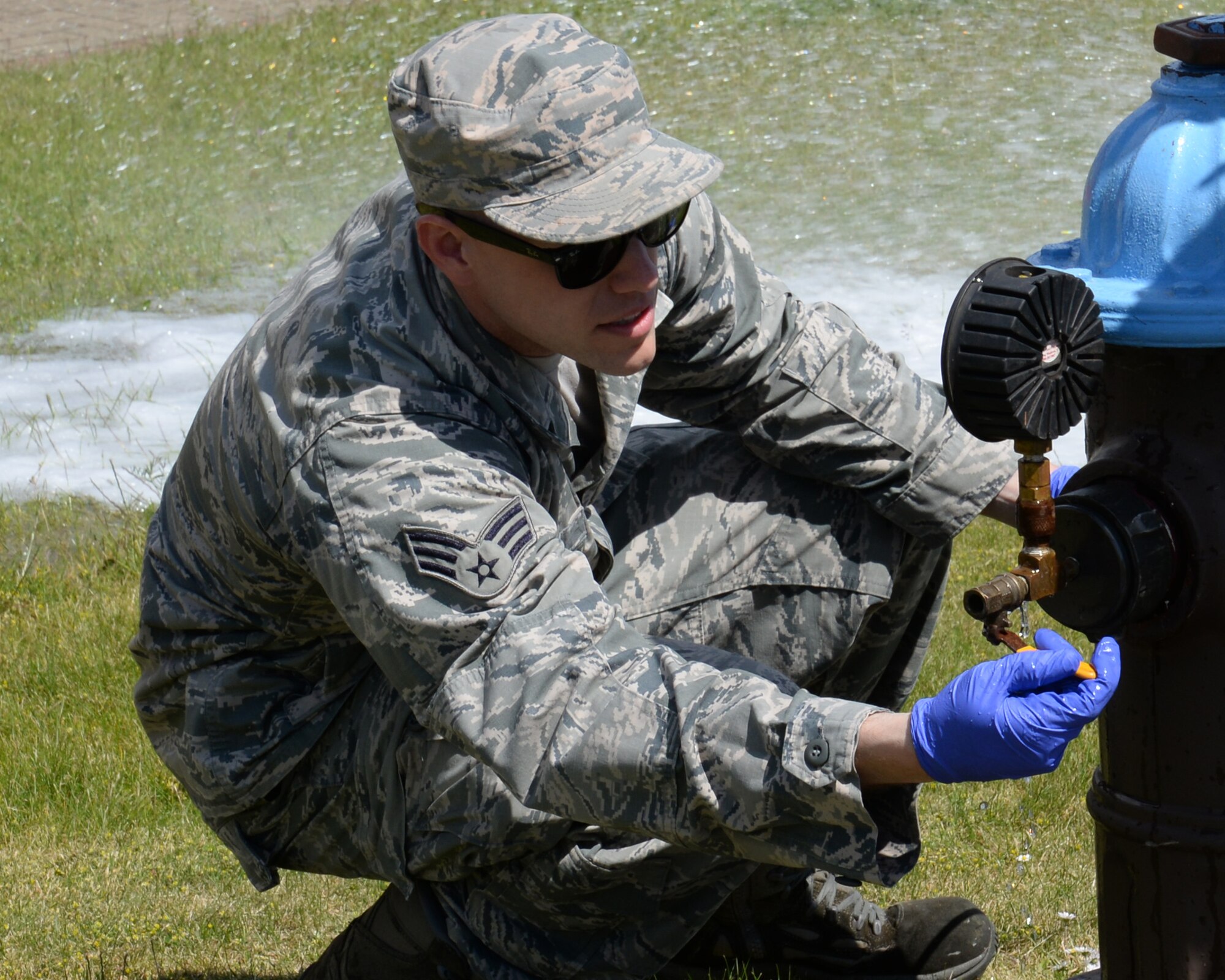 U.S. Air Force Senior Airman Joshua Slater, 100th Civil Engineer Squadron water and fuels system maintenance journeyman from Springfield, Mo., records the water pressure flowing through an open hydrant June 3, 2015, on RAF Mildenhall, England. There are no parameters on the residual water pressure; however, if the residual pressure is more than several pounds per square inch below the static pressure, it necessitates the need to investigate the situation as a foreign object may be constricting the flow of water. (U.S. Air Force photo by Gina Randall/Released)