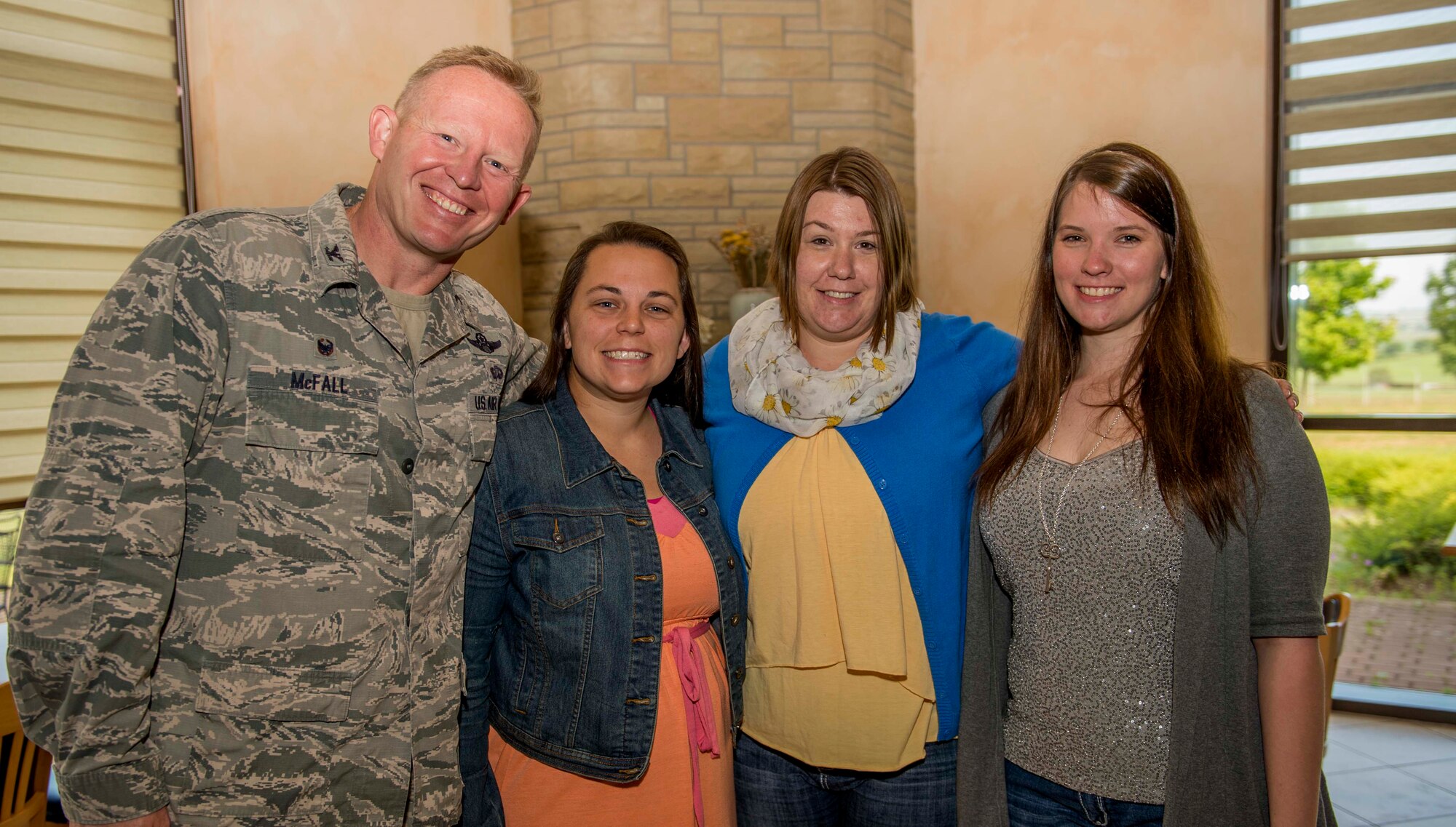 U.S. Air Force Col. Joe McFall, 52nd Fighter Wing commander, left, poses with three Key Spouses during the Key Spouse Appreciation Breakfast at Club Eifel on Spangdahlem Air Base, Germany, June 8, 2015. Twenty spouses received a certificate of appreciation and a symbolic key for their endeavors in the base community. (U.S. Air Force photo by Airman 1st Class Timothy Kim/Released)