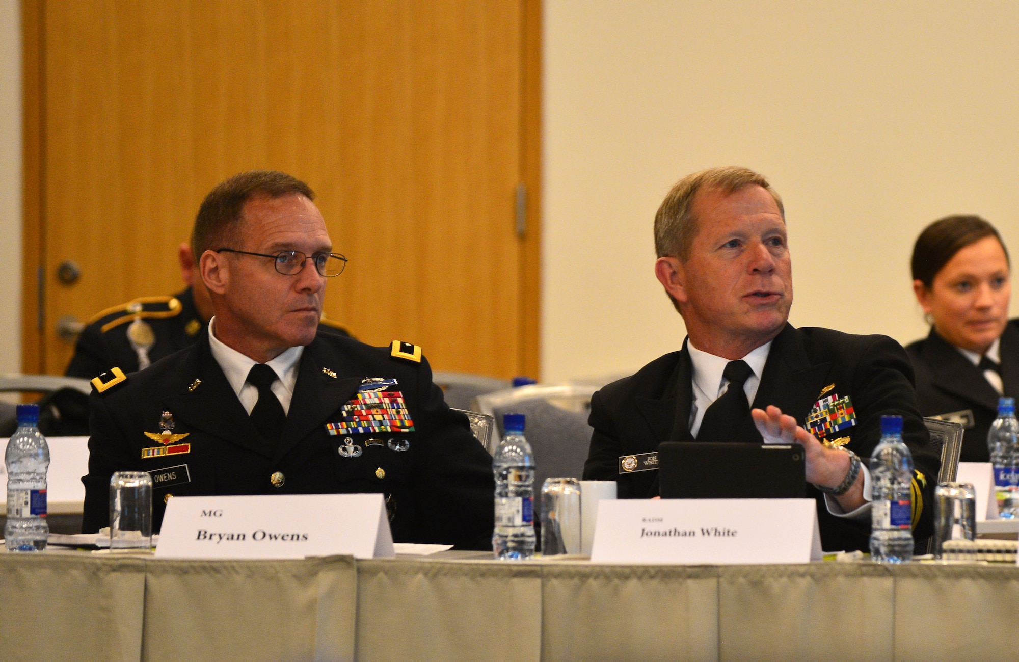 U.S. Navy Rear Adm. Jonathan White asks a question while U.S. Army Major Gen. Bryan Owens looks on during the Arctic Forces Security Roundtable, May 12, 2015 in Reykjavik, Iceland. Representatives from 11 nations across Europe and North America met for the ASFR in order to promote regional understanding and enhance multilateral security operations within the Arctic area. The United States co-led the talks alongside Norway. (U.S. Air Force photo by 2nd Lt. Meredith Mulvihill/Released)