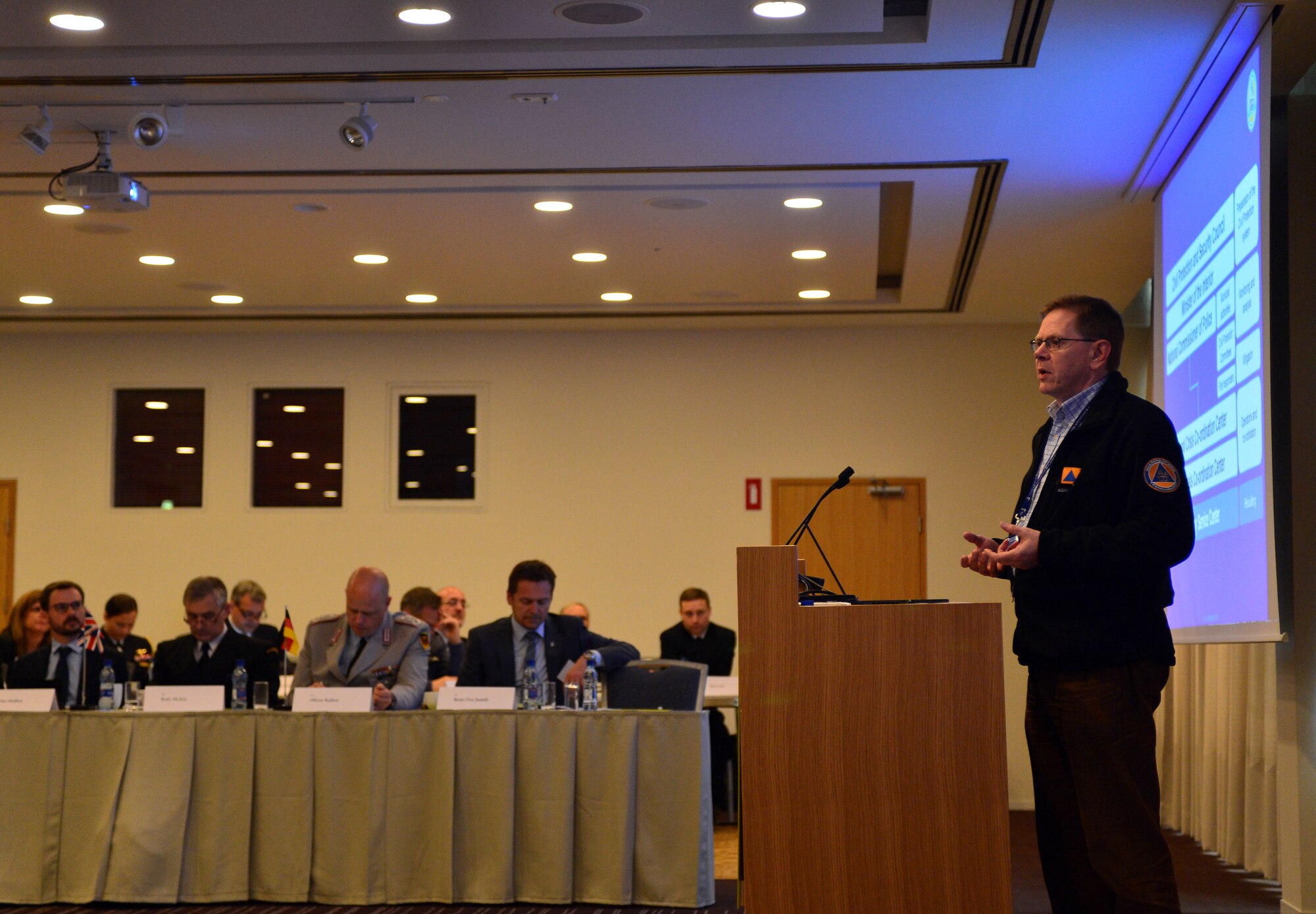 A representative of the Icelandic Civil Protection and Security Council gives a presentation to attendees of the Arctic Security Forces Roundtable, May 12, 2015 in Reykjavik, Iceland. Representatives from 11 nations across Europe and North America met for the ASFR in order to promote regional understanding and enhance multilateral security operations within the Arctic area. (U.S. Air Force photo by 2nd Lt. Meredith Mulvihill/Released)
