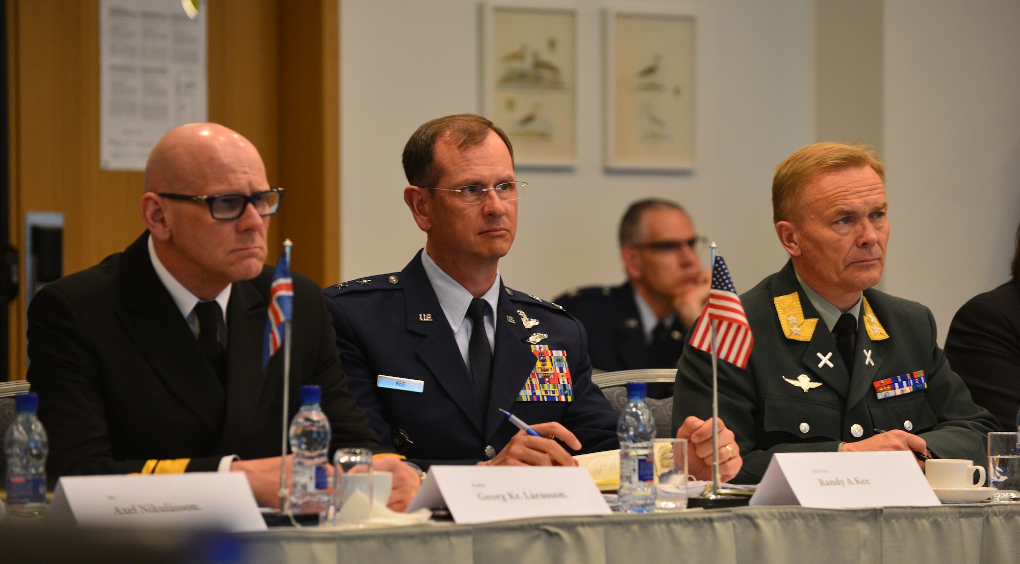 Icelandic Coast Guard Rear Admiral Georg Lárusson, U.S. Air Force Maj. Gen. Randy Kee and Norwegian Army Maj. Gen. Odin Johannessen listen to a presentation during the Arctic Security Forces Roundtable, May 12, 2015 in Reykjavik, Iceland. Kee and Johannessen co-led the conference, while Lárusson led coordination of host nation support. Representatives from 11 nations across Europe and North America met for the ASFR in order to promote regional understanding and enhance multilateral security operations within the Arctic area. (U.S. Air Force photo by 2nd Lt. Meredith Mulvihill/Released)