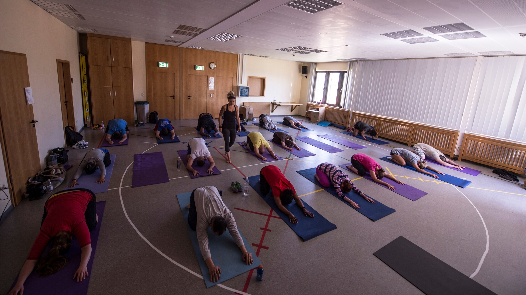 Mathea McKinley, a fitness instructor, leads a yoga and spirituality workshop in the base chapel on Spangdahlem Air Base, Germany, June 4, 2015, during the 52nd Fighter Wing’s Resiliency Day. The goal of the Comprehensive Airman Fitness initiative is to assist Airmen, civilians and family members to become resilient and better-equipped to deal with the challenges associated with military life. (U.S. Air Force photo by Staff Sgt. Christopher Ruano/Released)
